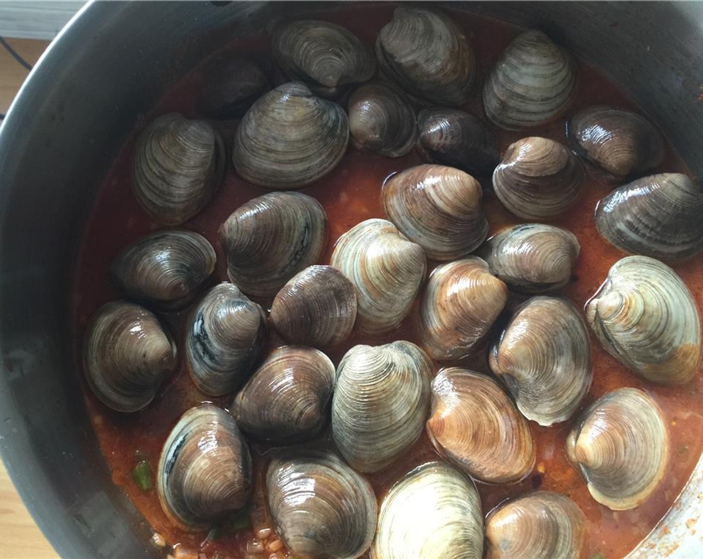 step 11 Add the Tomato Sauce (1/3 cup), Chicken Stock (1/2 cup) and pasta water. Mix well. Place the little neck clams over top.