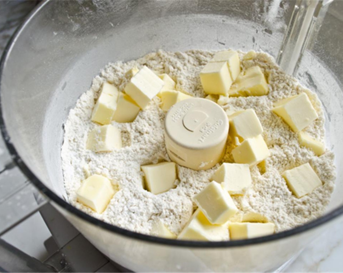 step 3 Add the Unsalted Butter (1/2 cup) and pulse until the mixture resembles coarse curd. Add the Philadelphia Original Soft Cheese (2 Tbsp) and pulse a few times until incorporated with a few pea-sized pieces of cream cheese intact. Transfer mixture to a mixing bowl.
