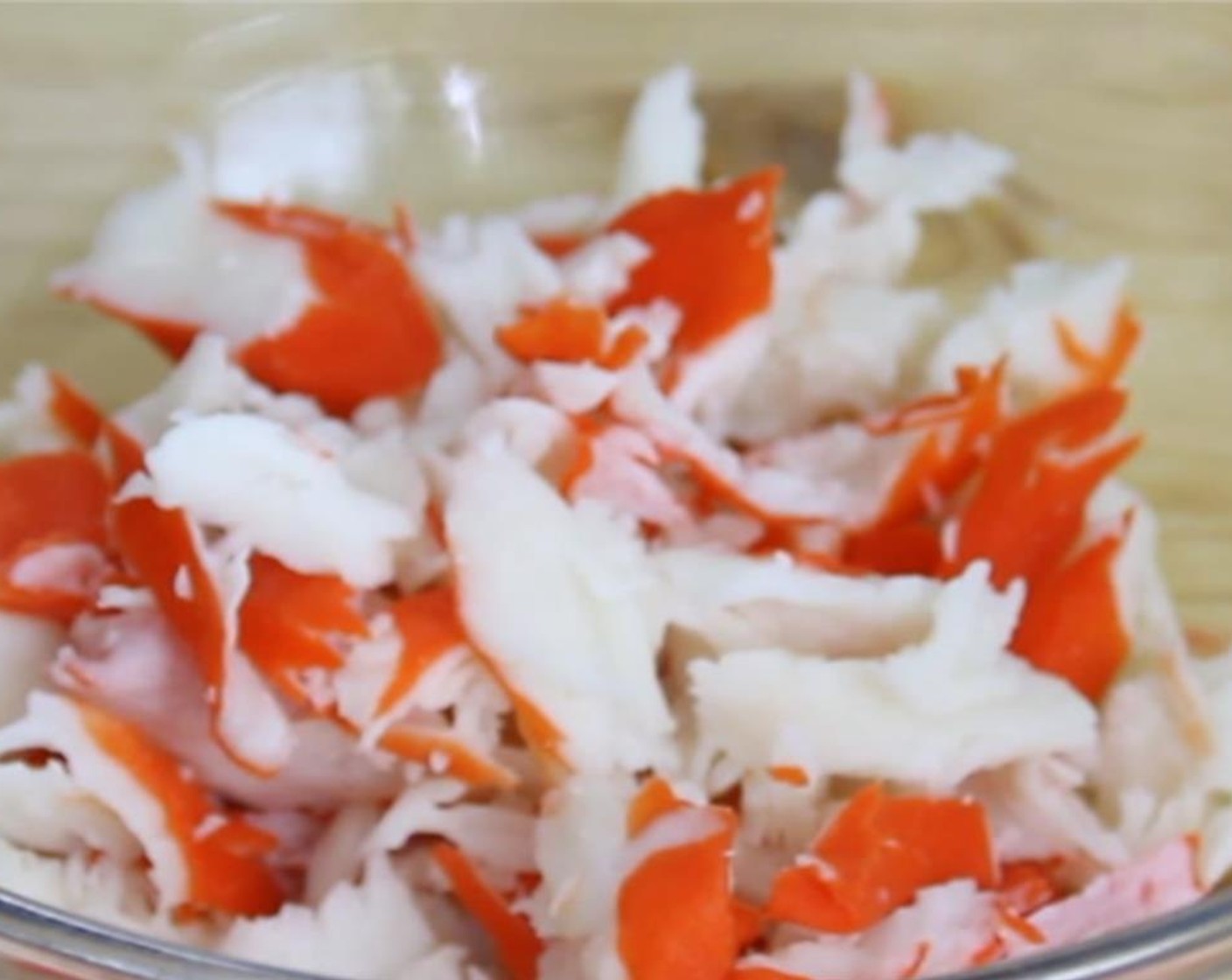 step 1 Place the Lump Crab Meat (8 oz) into a mixing bowl and use two forks to shred it into bite size pieces.