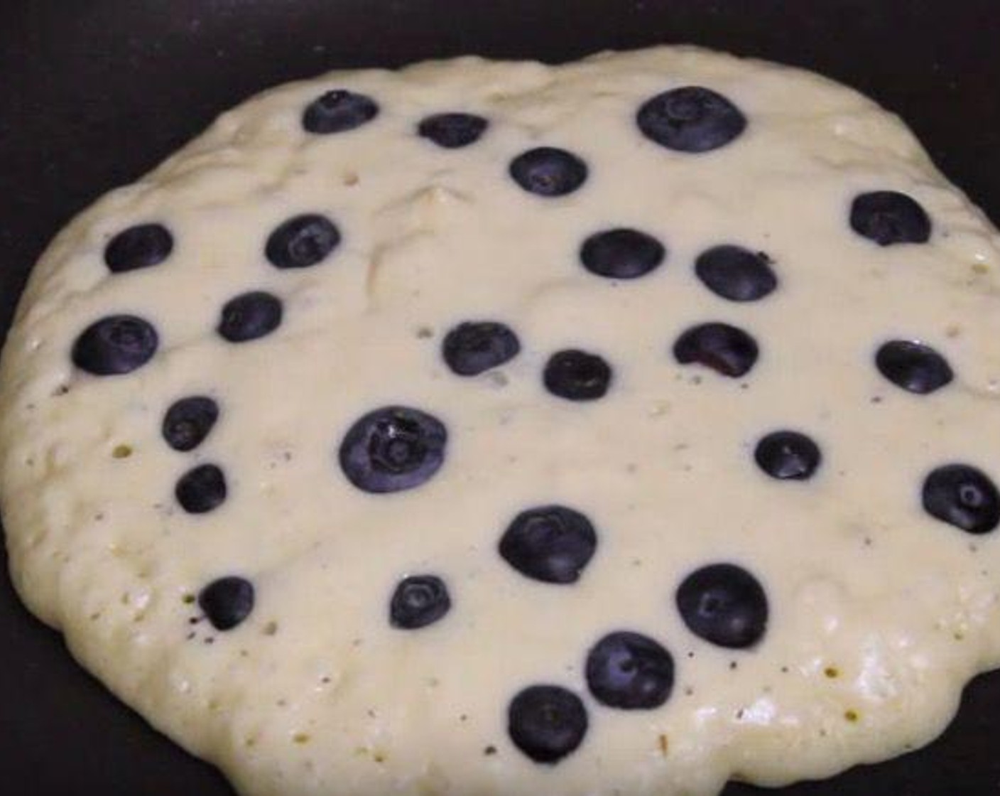 step 2 Grease the pan and add a spoonful of batter. Then put the Fresh Blueberry (1 cup) on top. Once the edge is dry, flip the pancake. Served with Maple Syrup (to taste) and enjoy!