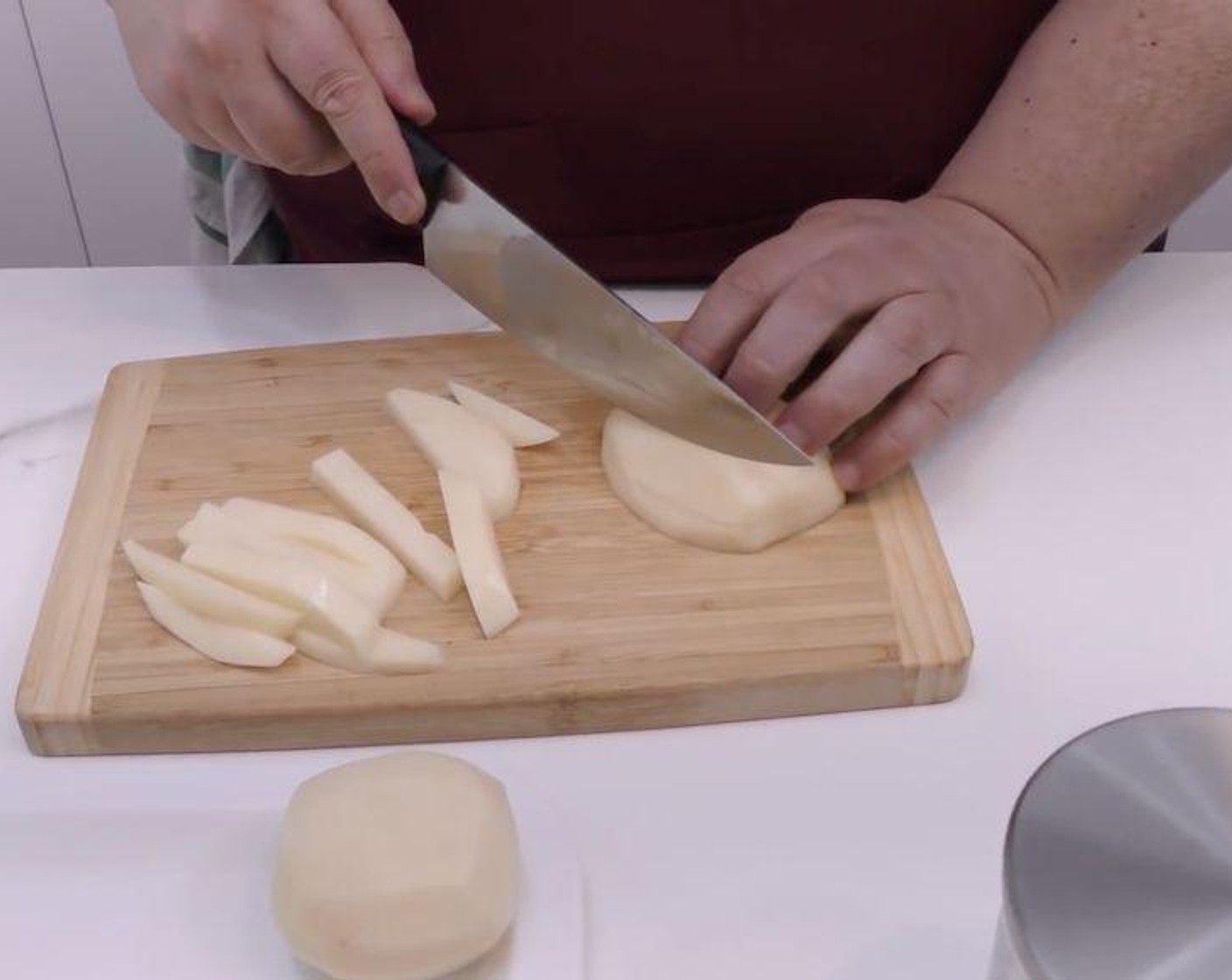 step 1 Peel and wash the White Potatoes (3). Proceed to slice the potatoes into medium-thick slices then cut them lengthwise into fries.