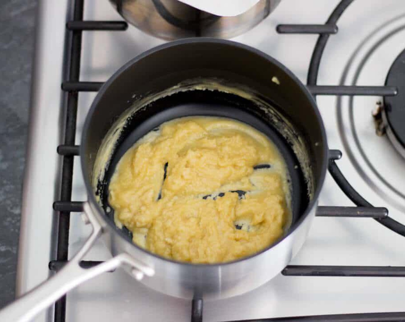 step 3 Meanwhile, let’s make a roux , a butter flour combo that’s used to thicken sauces. Pop a medium saucepan over a low/medium heat and melt the Butter (2 oz). Once it’s melted, throw in the All-Purpose Flour (1/3 cup) and stir constantly with a wooden spoon.