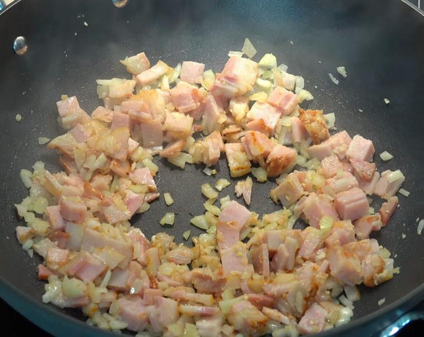 step 1 In a large fry pan over medium-high heat, add Bacon (6 slices), Onion (1), and Garlic (2 cloves). Stir for 1-2 minutes, or until onions start to soften and bacon has a bit of color.