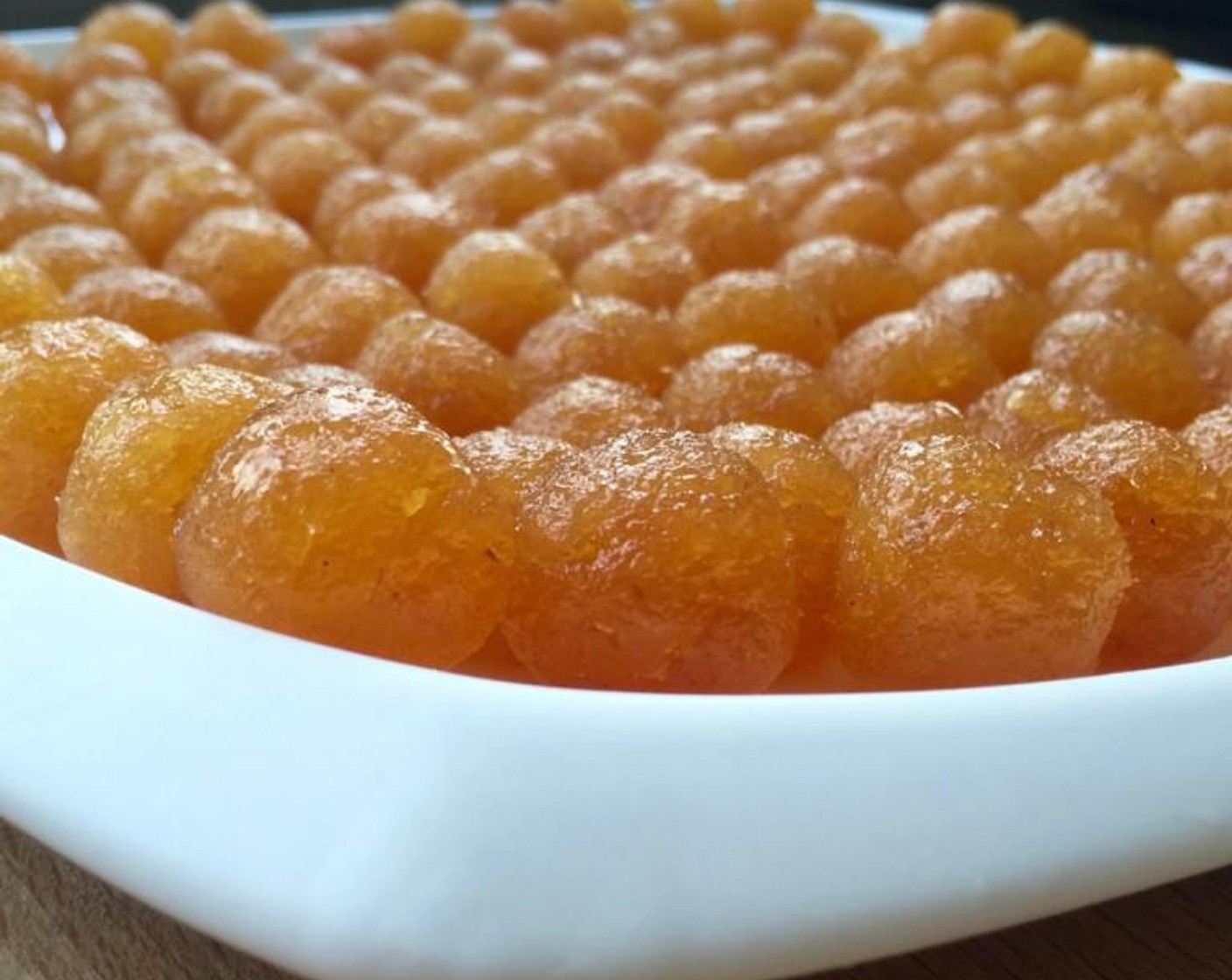 step 4 To make the pineapple tarts, first roll the pineapple filling/paste into balls, about 5 gram each. This can be done ahead of time and set aside until needed. To do this, have a wet cloth nearby so you can wet your hands slightly to prevent the pineapple paste from sticking to your hands when you shape them.