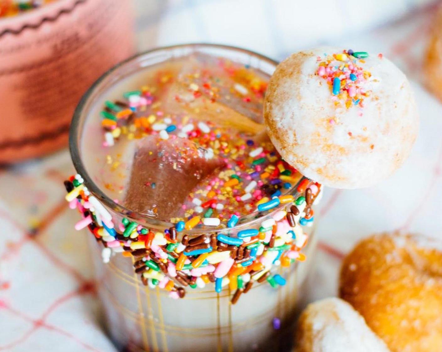 step 4 Pour liquid over ice. Top with sprinkles and Mini Donuts (to taste).