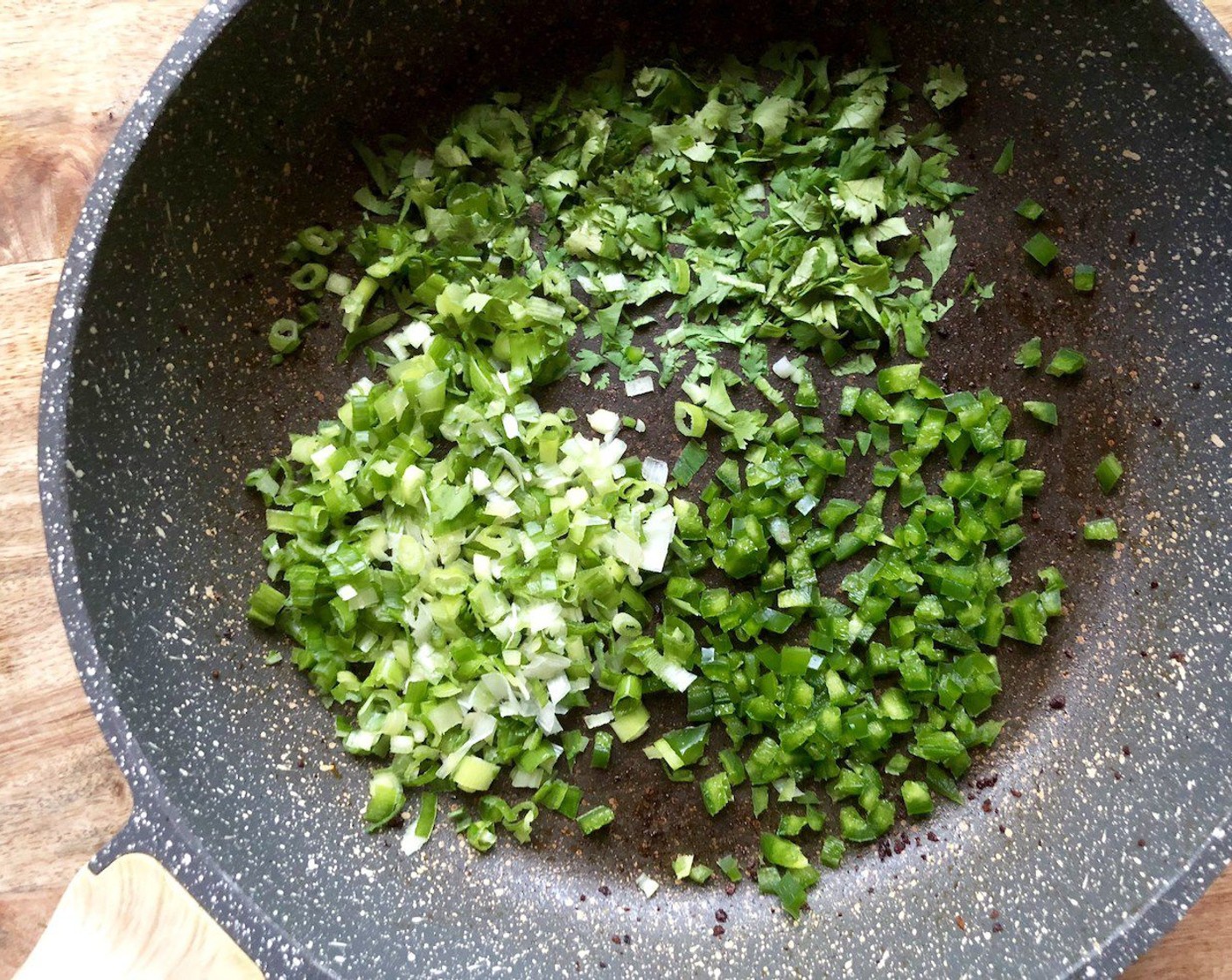 step 6 Return the saucepan to medium heat.  Add the chopped Scallion (1 bunch), Jalapeño Pepper (1), and Fresh Cilantro (1/4 cup) and cook until tender, 1 to 2 minutes.