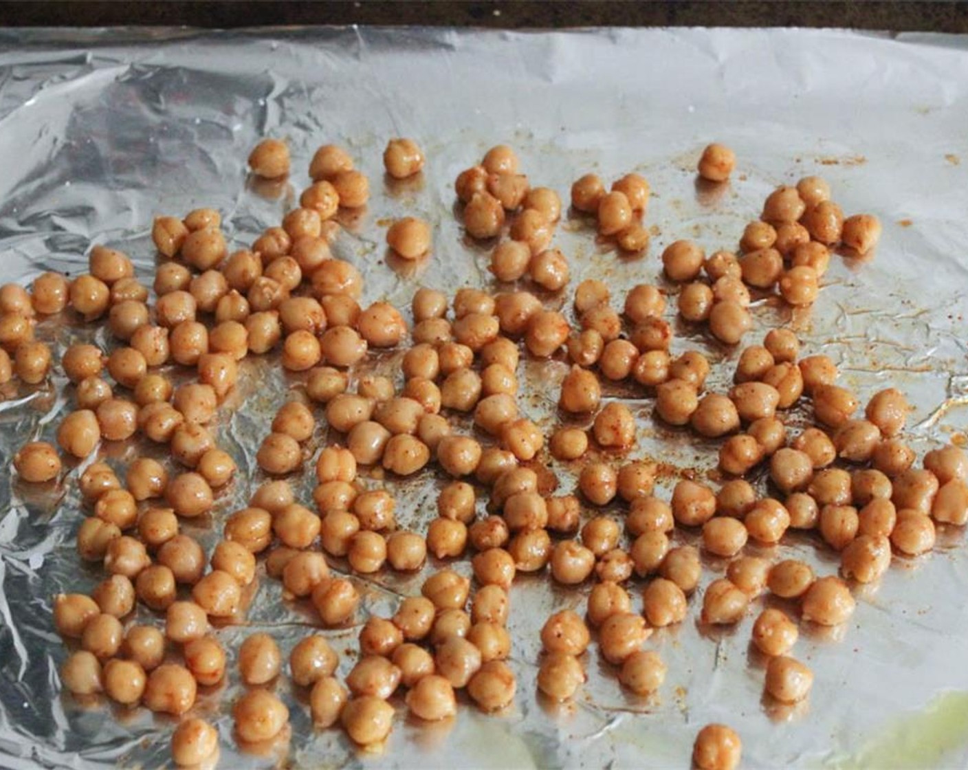 step 3 Place the chickpeas on the prepared baking sheet. Drizzle with Extra-Virgin Olive Oil (1 Tbsp) and sprinkle with the Smoked Paprika (1/2 tsp), Kosher Salt (1/2 tsp), and Cayenne Pepper (1 pinch). Toss to coat.
