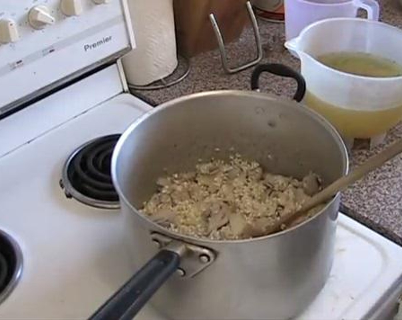 step 3 Add the Chicken Stock (4 cups) cup by cup,waiting for each cup to be absorbed by the rice on each round. Stir frequently.