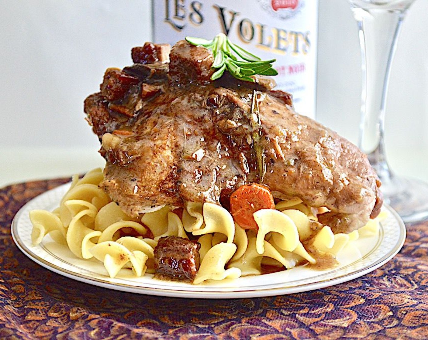 step 11 Place the chicken on a large, deep platter and spoon the sauce all over it. Serve immediately with buttered noodles and/or crusty bread!