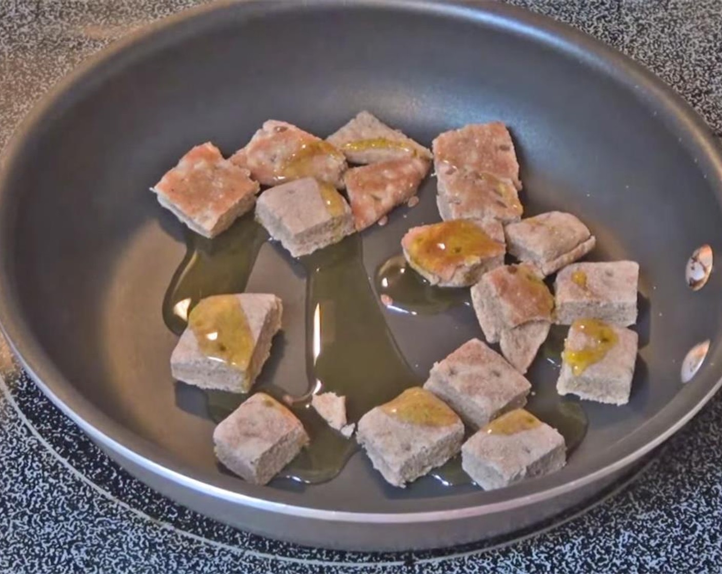 step 3 For croutons, place the Bread (to taste) in a skillet, and drizzle with Olive Oil (as needed). Season with Salt (to taste) and Ground Black Pepper (to taste), and mix well. Cook over medium heat until crisp, shaking skillet often.