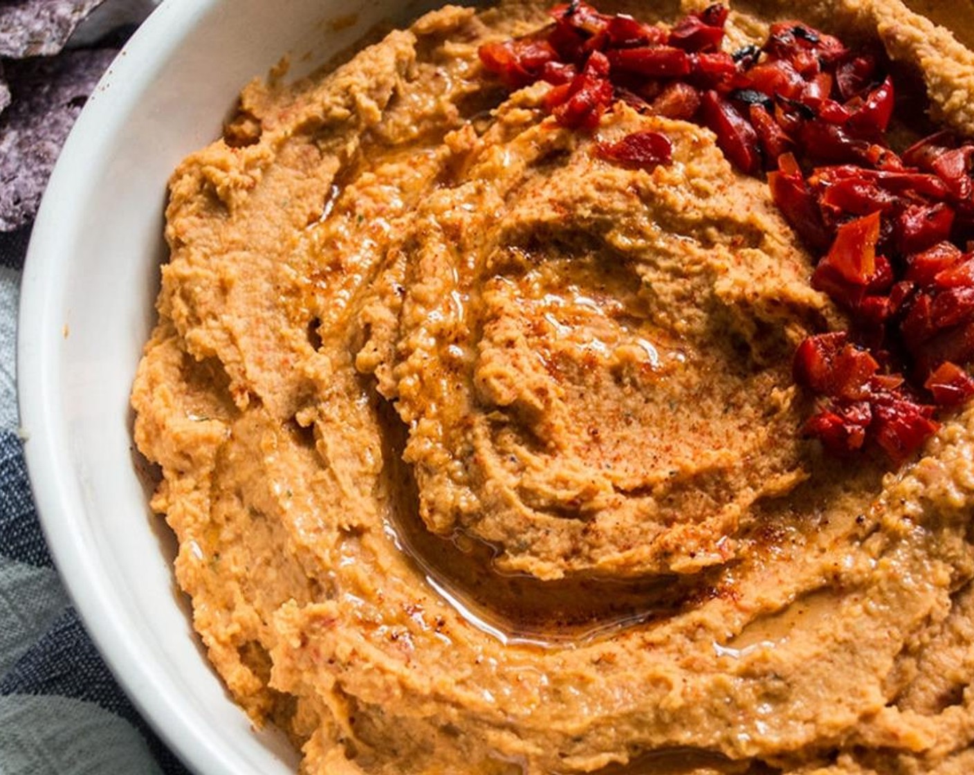 step 7 Transfer hummus to a small serving bowl and drizzle with Roasted Walnut Oil (2 Tbsp). Take the reserved roasted red peppers and chop finely, then use as garnish, along with a light sprinkle of Smoked Paprika (to taste).