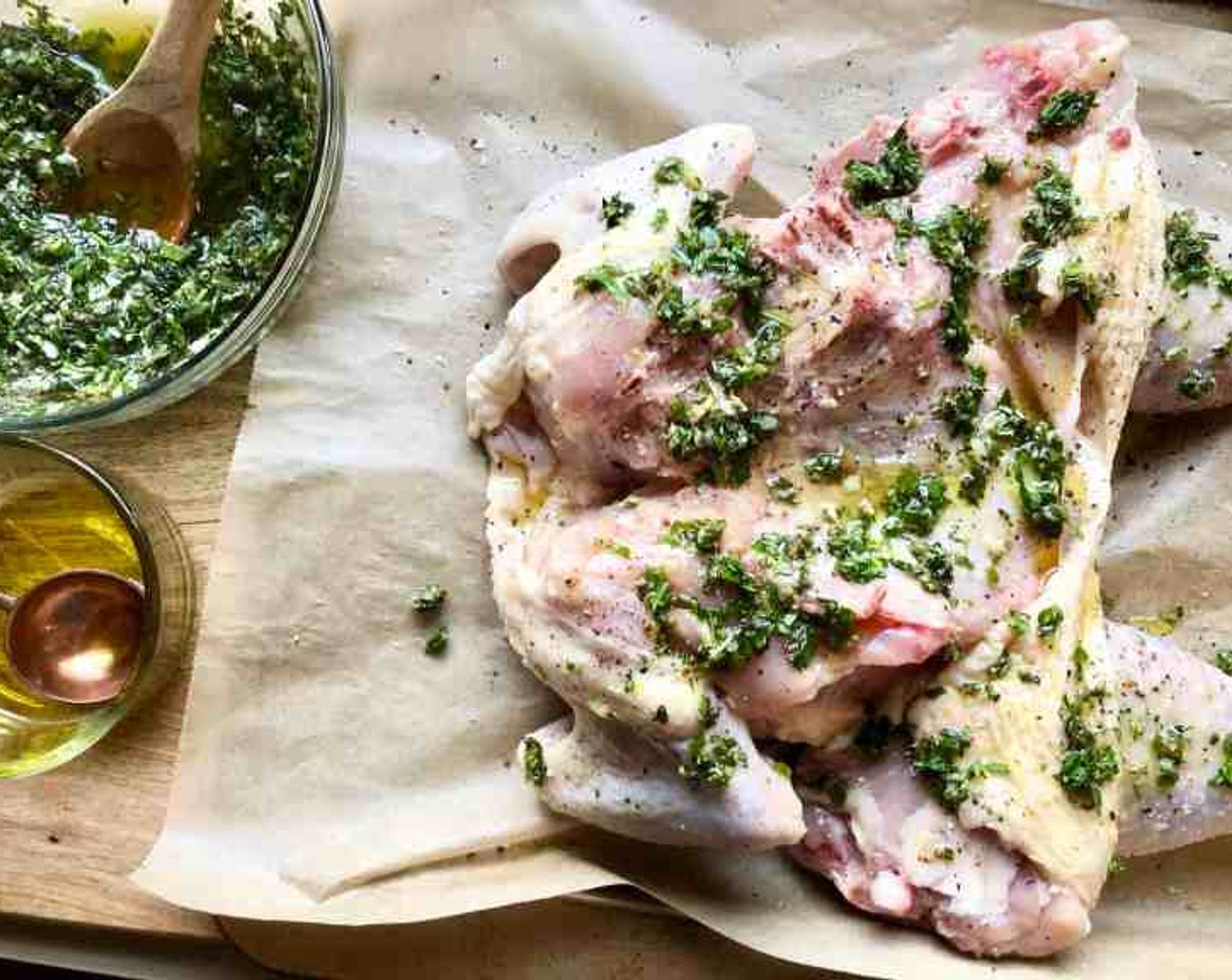 step 3 Place the Whole Chicken (1) on a large baking pan lined with parchment paper and cover it on all sides with 2 Tbsp of olive oil along with a generous seasoning with Kosher Salt (to taste) and Freshly Ground Black Pepper (to taste).