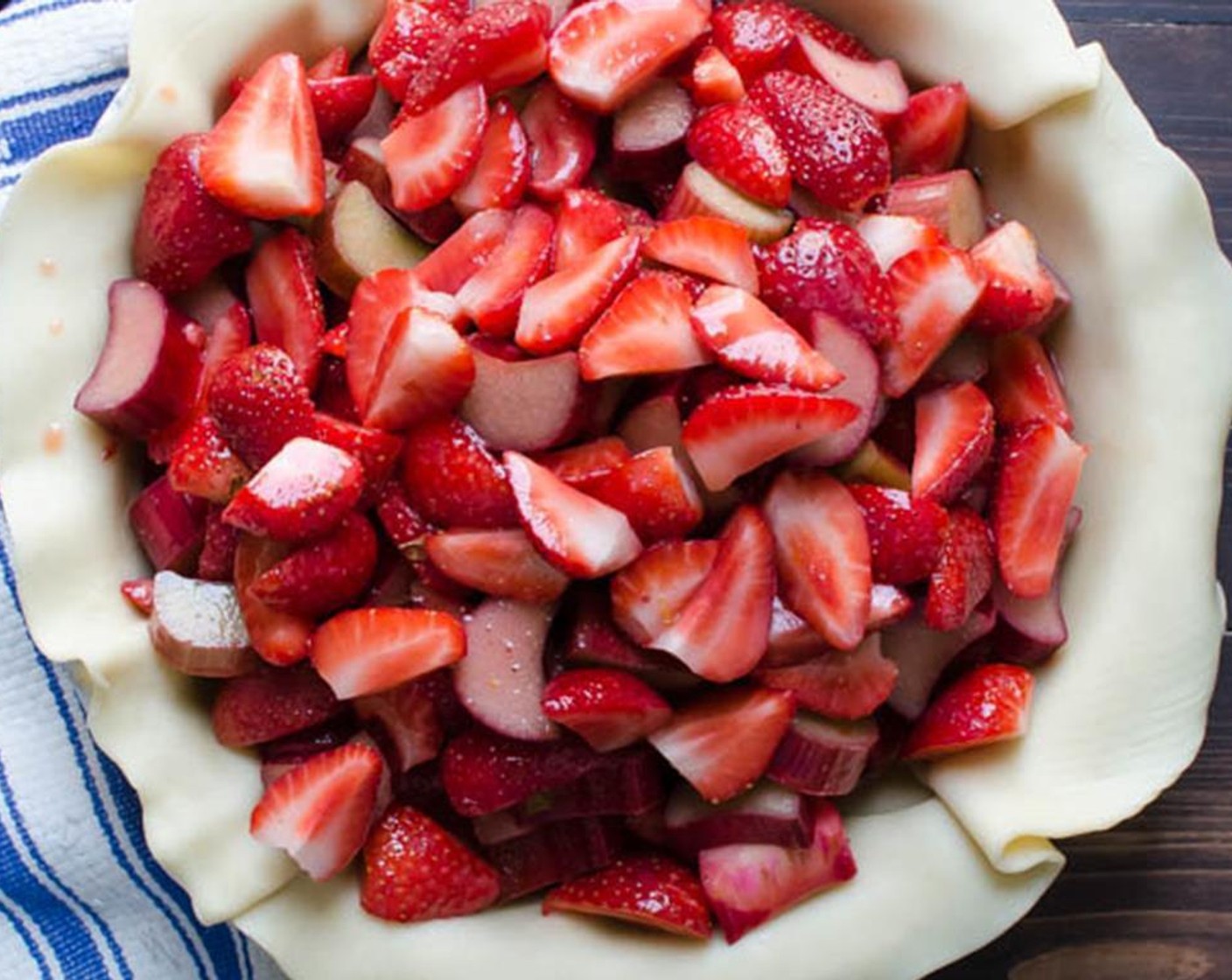 step 3 Transfer the berries and rhubarb to the pie shell, leaving any excess liquid in the bottom of the bowl and spread evenly into the crust.