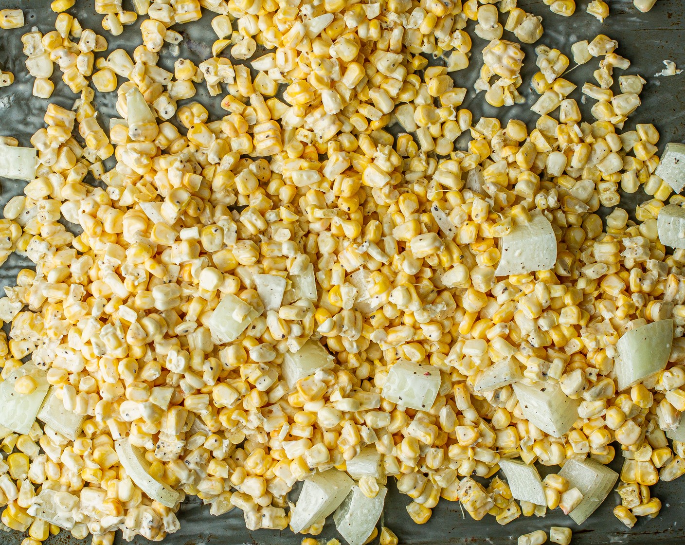 step 5 In a medium bowl, add the Corn (3 ears), Onion (1/2), Fresh Cilantro (1/4 cup),  2 Tbsp of Mayonnaise (2 Tbsp), 4 Tbsp of juice from 2 Limes (2), ¼ cup of Cotija Cheese (1/4 cup), Kosher Salt (1/2 tsp), and Ground Black Pepper (1/4 tsp) and mix well.