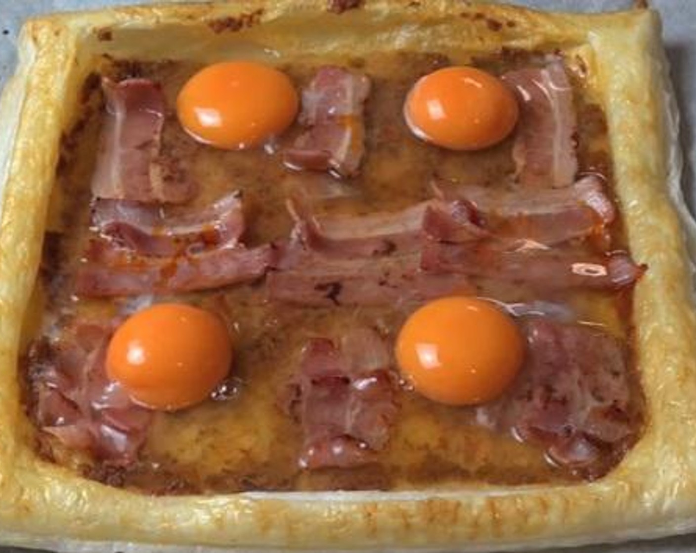 step 5 Takeout the tart from the oven and gently Put your cracked Eggland's Best Classic Eggs (4) on your tart. Bake inside an oven for another 10 minutes.
