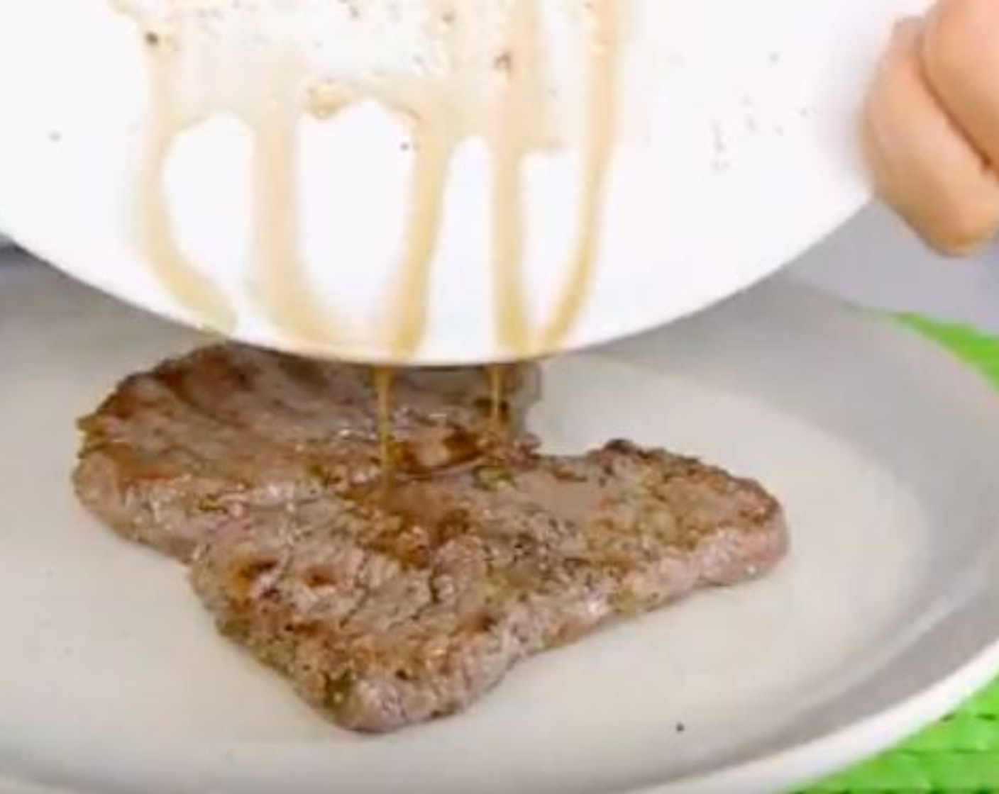 step 8 Once this is done let’s start to assemble the dish, starting by placing the steak in the middle of the plate with all its delicious juices, you don't want to leave them behind as these are liquid gold!