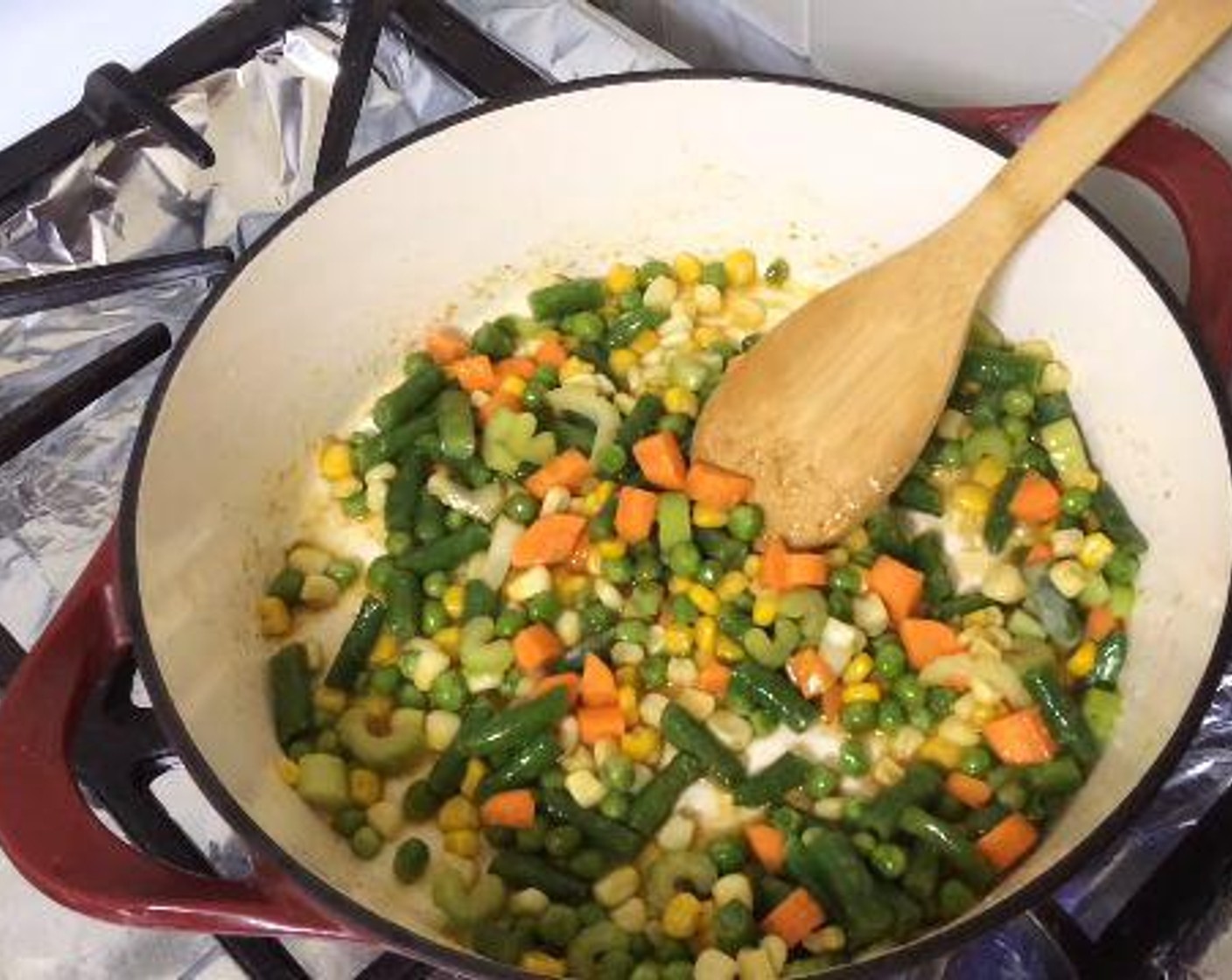 step 2 Stir in the Frozen Green Beans (1/2 cup), Frozen Corn Kernels (3/4 cup), Celery (1 stalk), Carrot (1), and Frozen Green Peas (1/2 cup) and cook them for about 2 minutes.