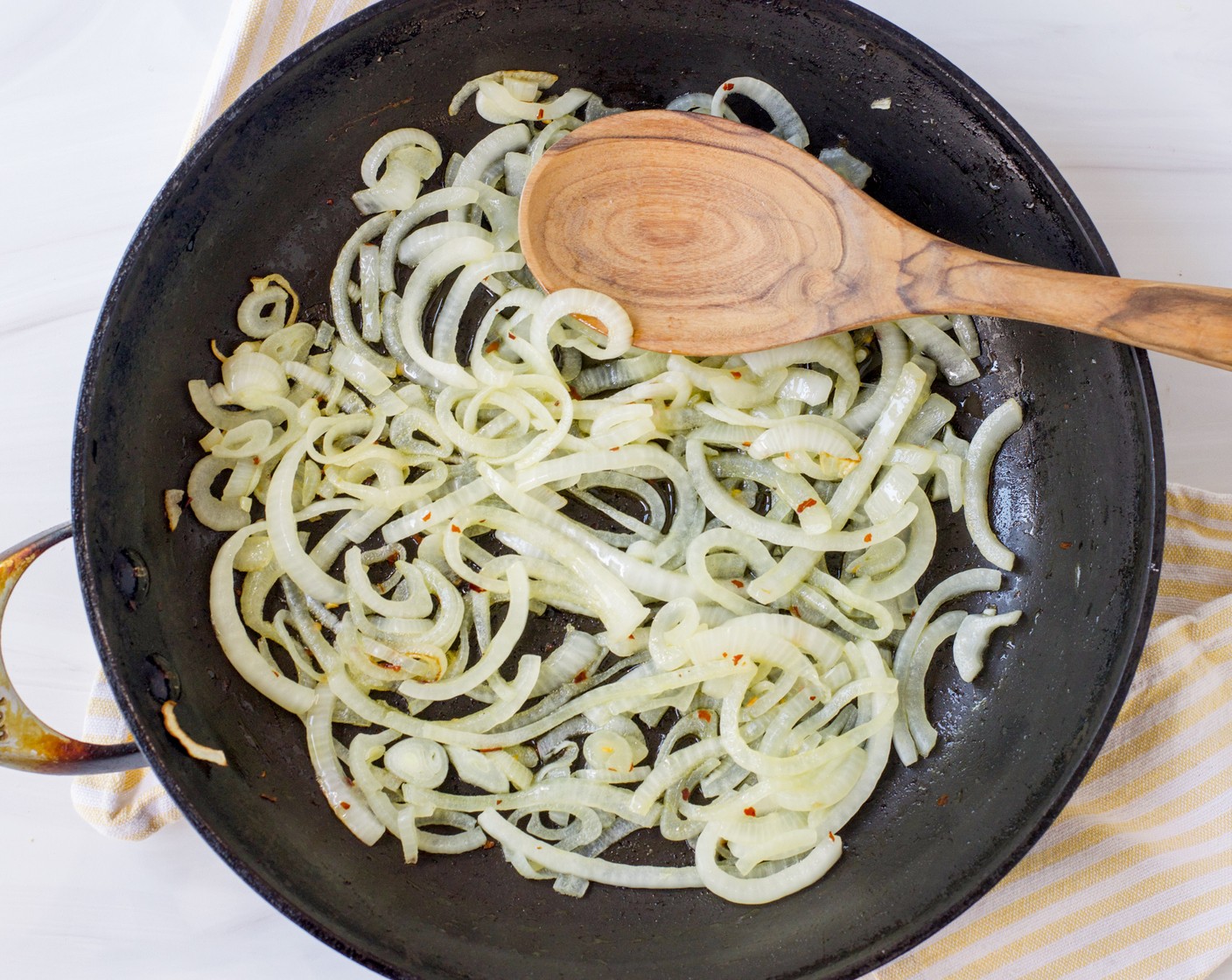 step 1 Heat the Extra-Virgin Olive Oil (3 Tbsp) in a deep, 12-inch skillet or sauté pan with a tight-fighting lid. Add the Yellow Onion (1) and sauté over medium heat until softened, about 5 minutes.