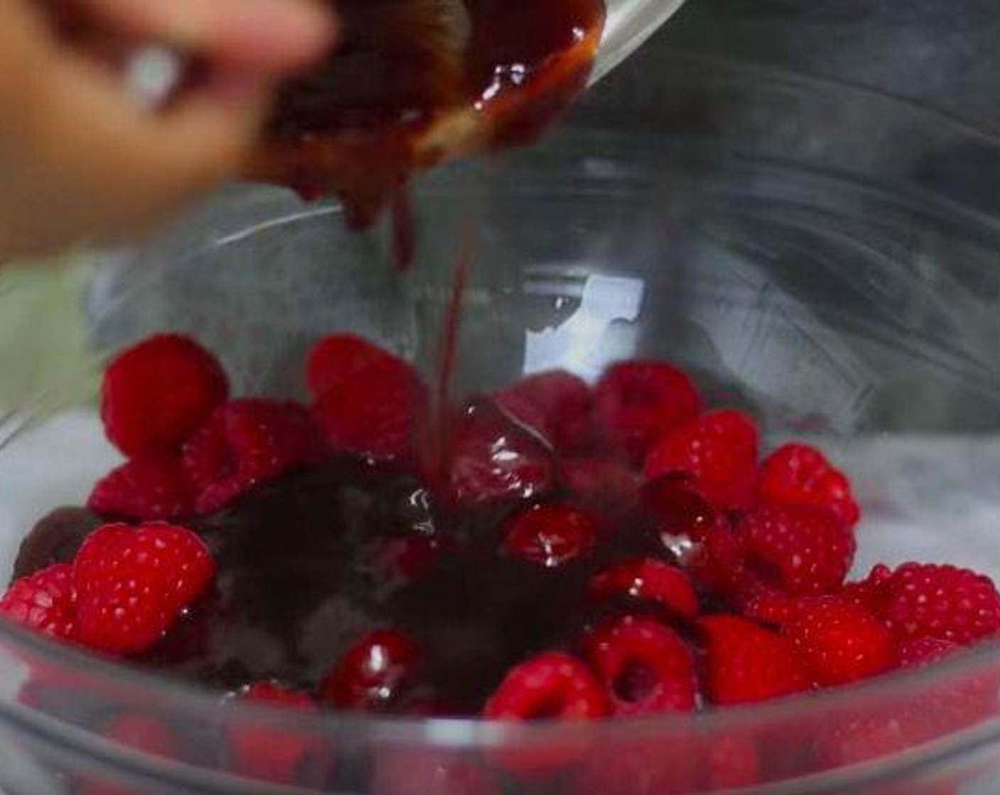 step 6 Take a saucepan and add Raspberry Jam (1 cup) and heat it up in medium heat. Toss together the jelly with Fresh Raspberries (1 1/3 cups) and pour on top of the cheesecake.