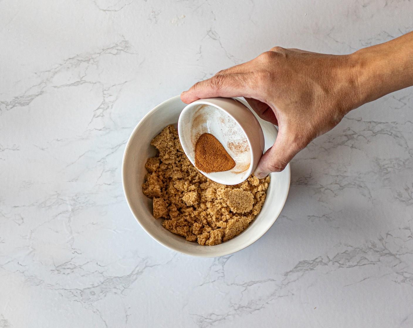 step 10 While they bake, place Brown Sugar (1 cup) and Simply Organic Cinnamon, Ground (1 Tbsp) in a bowl and mix well.