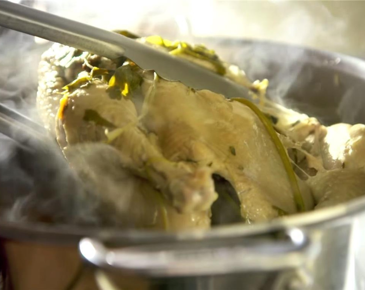 step 5 Carefully place chicken in a large bowl. Strain broth through a fine strainer, and set aside. When chicken has cooled, remove bones, shred the meat and set aside. Cook Egg Noodles (1 pckg) according to package instructions and set aside.