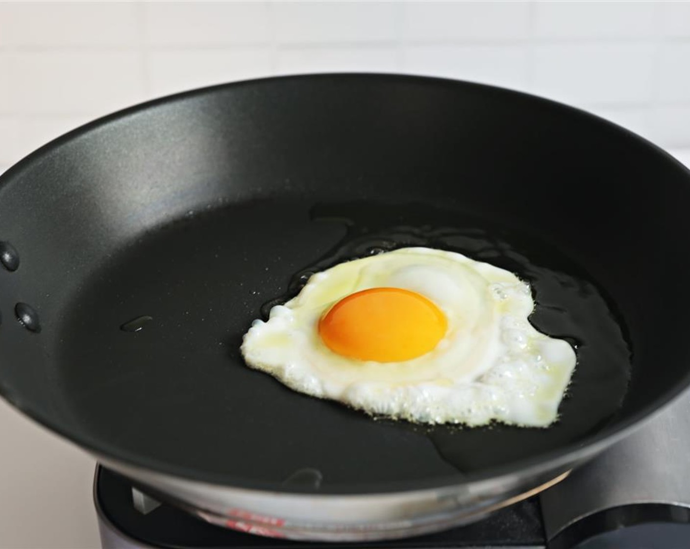 step 3 Cook until white is set and yolk is slightly runny, approximately 4-5 minutes.