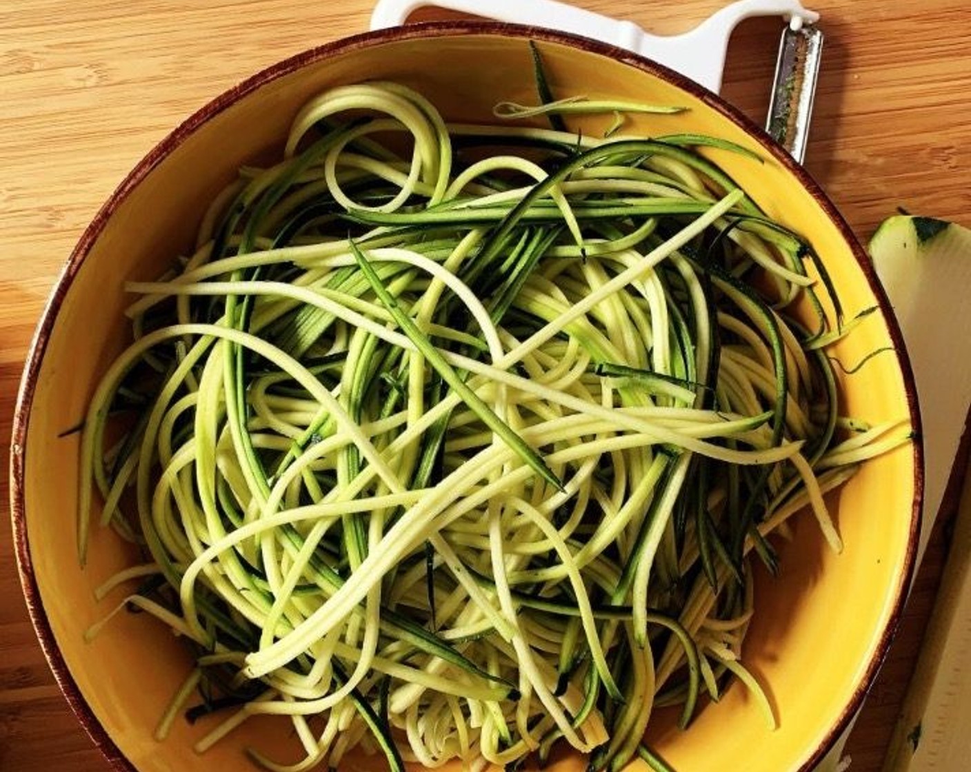 step 3 Using a spiralizer, shred your Zucchini (2) into noodles.