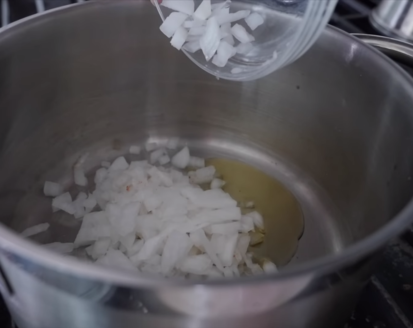 step 6 Add Onion (1) and Garlic (3 cloves) and cook for 3-5 minutes, until fragrant and translucent.