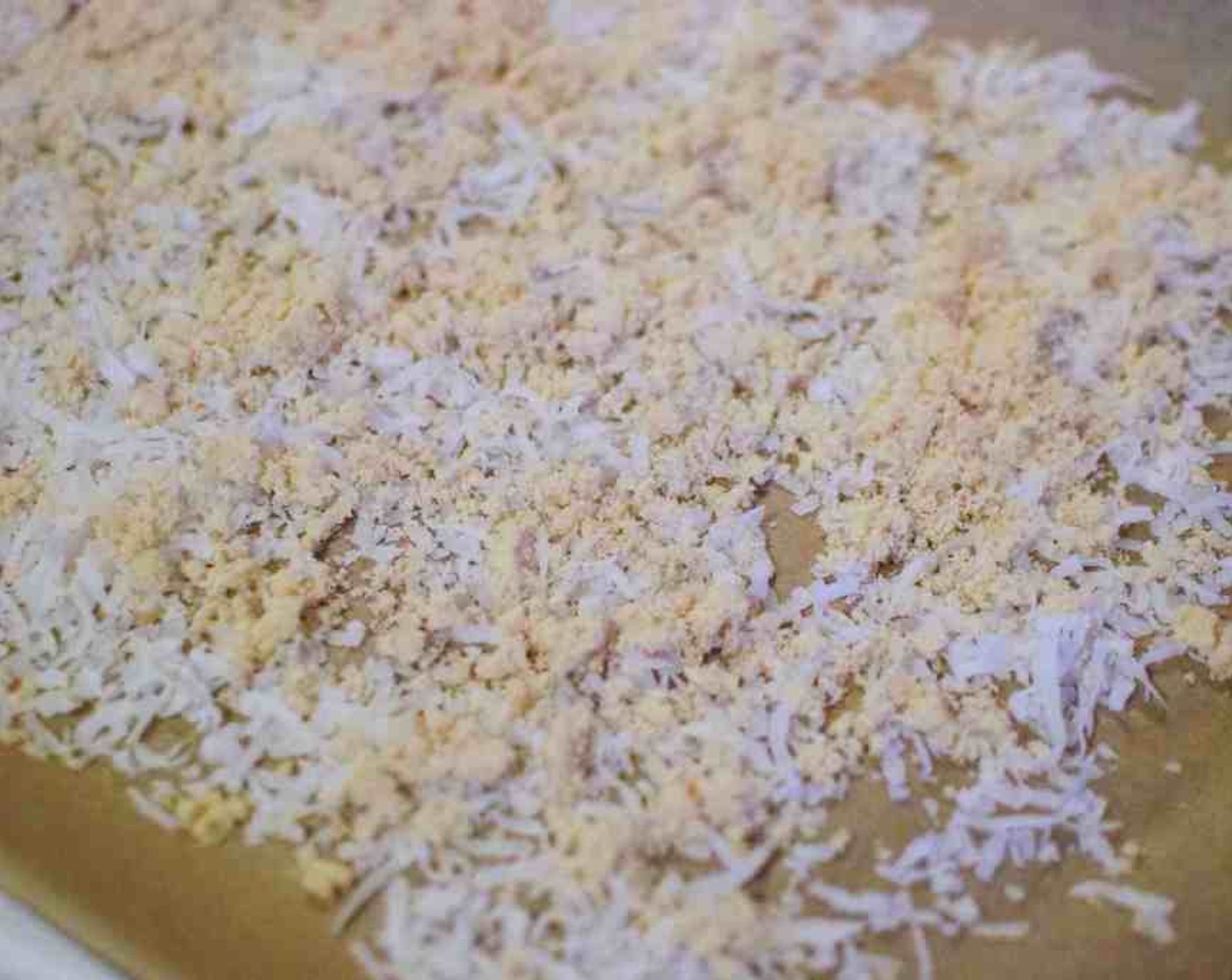 step 6 Line a rimmed baking sheet with parchment paper. Spread Sweetened Coconut Flakes (1 cup) on the prepared baking sheet. Sprinkle Brown Sugar (4 Tbsp) on top.