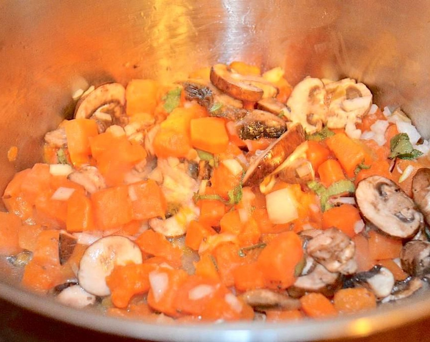 step 2 Add in the Cremini Mushrooms (115 g) and let them cook another couple of minutes. Stir in the Onion (1), Garlic (2 cloves), and Fresh Sage (1 Tbsp) and stir, letting them get fragrant for another minute.