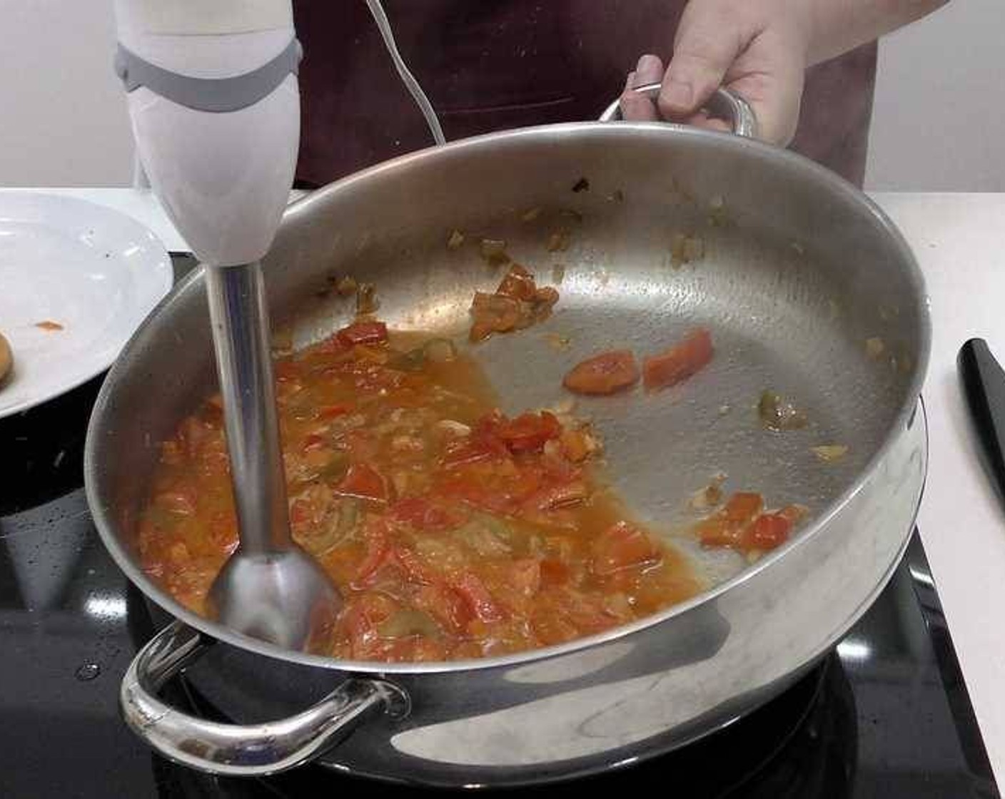 step 3 Next, using a stick blender, blend all the contents of the pan until you have a smooth sauce left.