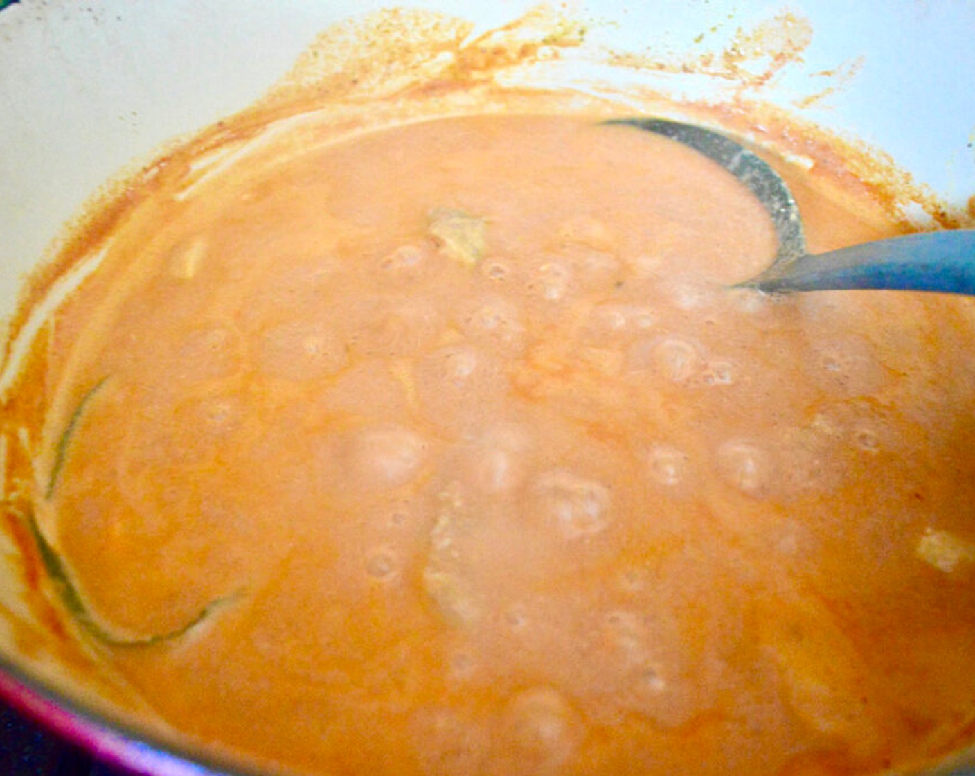 step 4 Finally, add the remaining Butter (3 Tbsp), Tomato Sauce (2 cups), Kemps Half & Half (2 cups), Bay Leaves (2), and Plain Greek Yogurt (1/2 cup). Let it gently bubble and develop flavor for 15 minutes, stirring often.