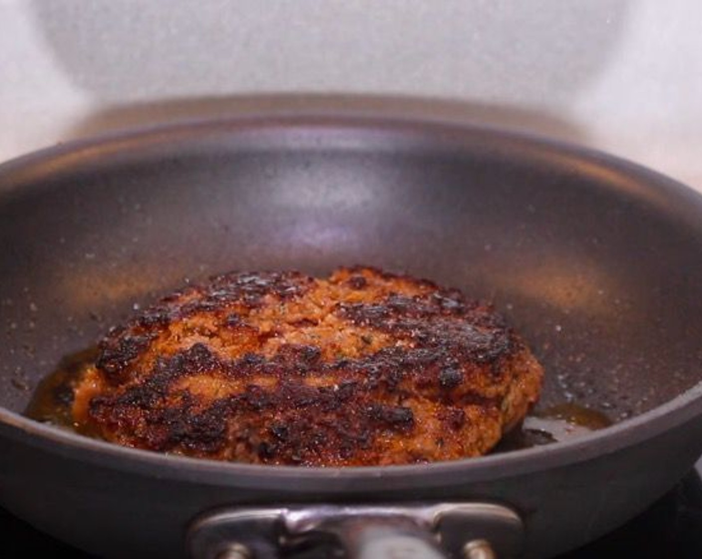 step 7 In a pan over high heat with no oil, sear the patty for 4 minutes.