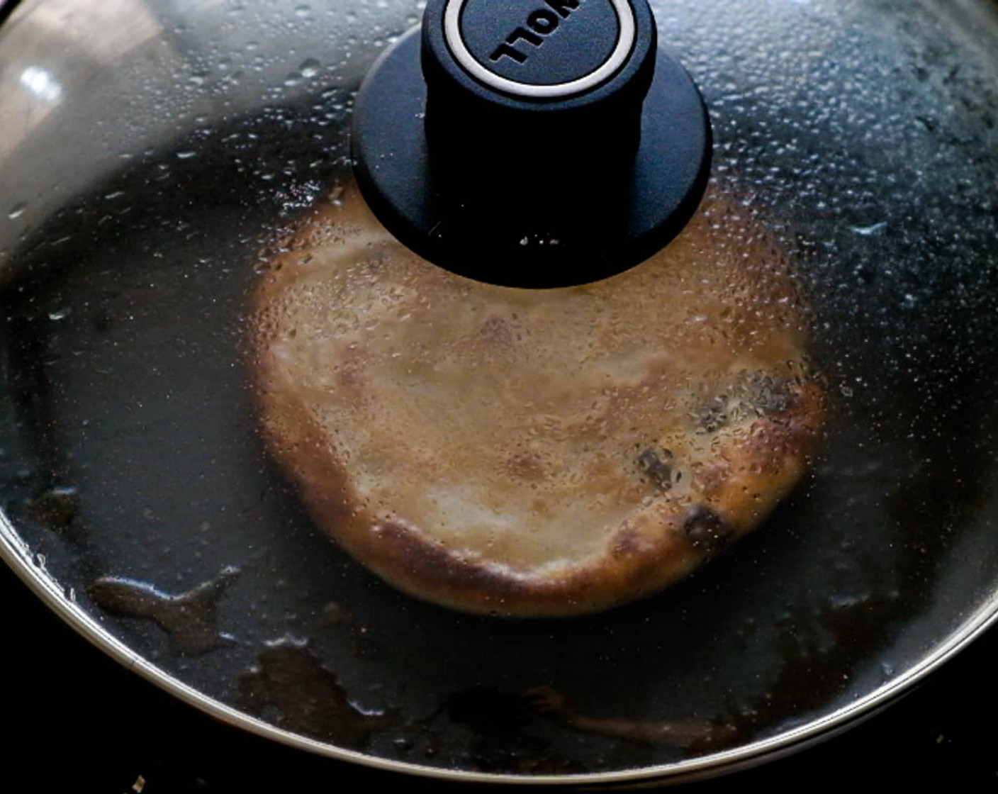 step 11 Heat a flat frying pan over medium-high heat and then film the bottom with Peanut Oil (as needed). As soon as the oil is hot, place the bread in the pan. Cook until the bottom is golden. Flip and cover, until the other side turns golden too.