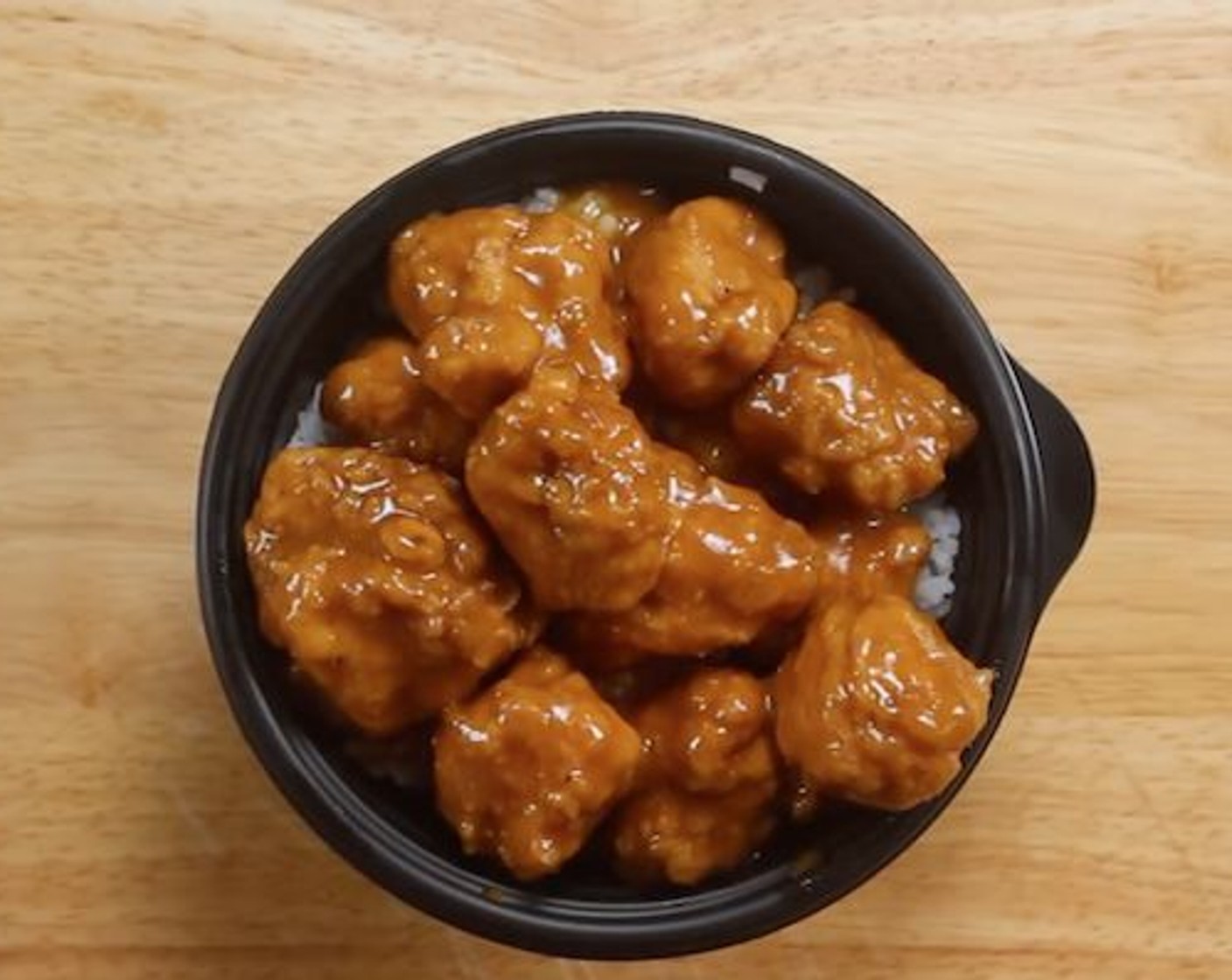 step 8 To serve add White Rice (to taste) into a bowl and place orange chicken on top. Enjoy!