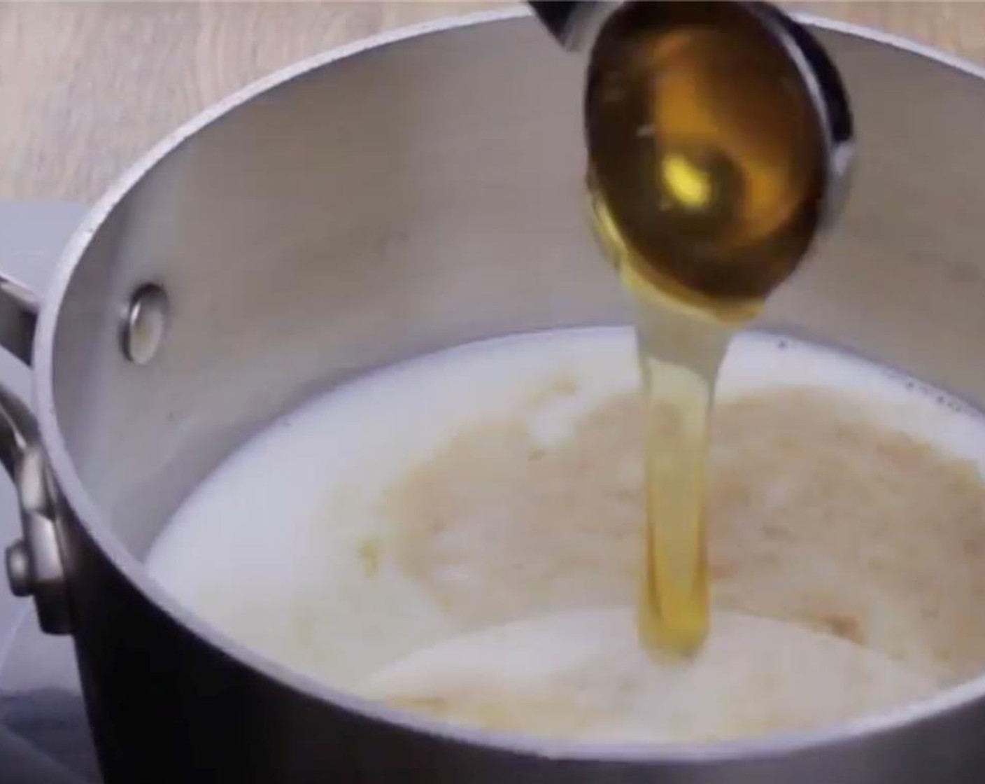 step 2 Heat a saucepan over medium-low heat, pour in 2% Reduced Fat Milk (1 cup), Unsalted Butter (2 Tbsp), Peanut Oil (2 Tbsp), Honey (1 Tbsp), and Vanilla Extract (1 tsp). Mix until the butter and honey have fully melted, then turn off the heat.