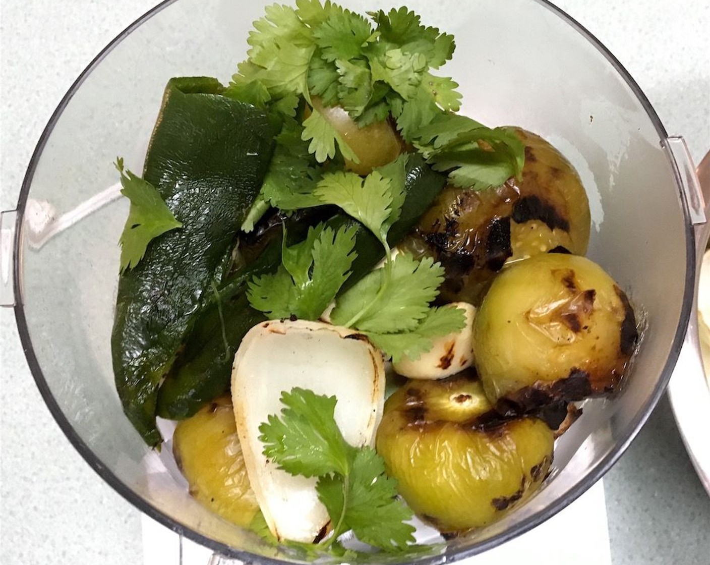 step 3 Working in batches, combine tomatillos, peppers, onion, garlic, and Fresh Cilantro (1 cup) in bowl of food processor or blender and pulse until pureed to desired consistency.