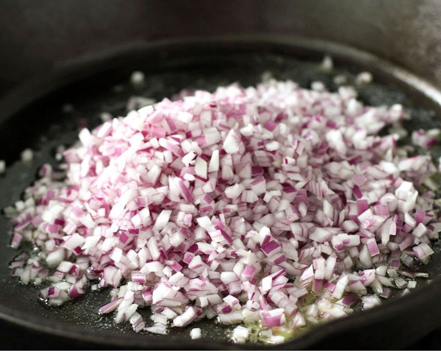 step 5 Heat the Unsalted Butter (2 Tbsp) and Olive Oil (1 tsp) in a deep skillet or sauté pan over medium-high heat. Once hot, add the Red Onion (1) and sauté until softened, about 1-2 minutes.