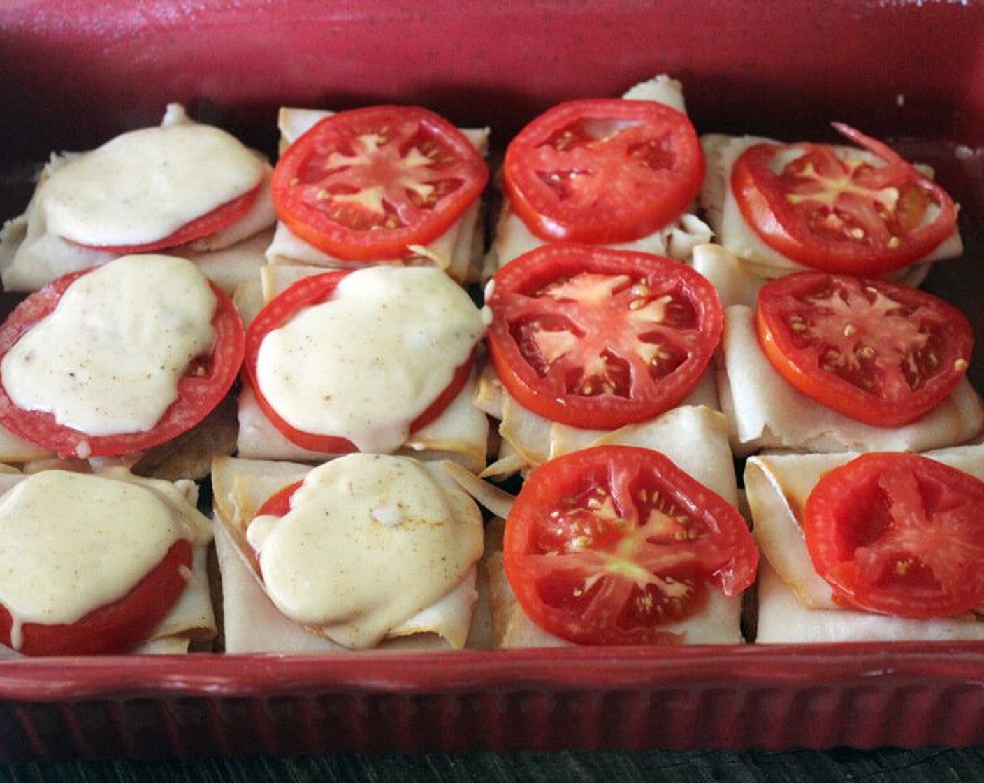 step 7 Place a layer of Deli Turkey (3 1/4 cups) on the buns, then a slice of Tomatoes (3). Top the tomato with about 2 tablespoons of the cheese gravy.