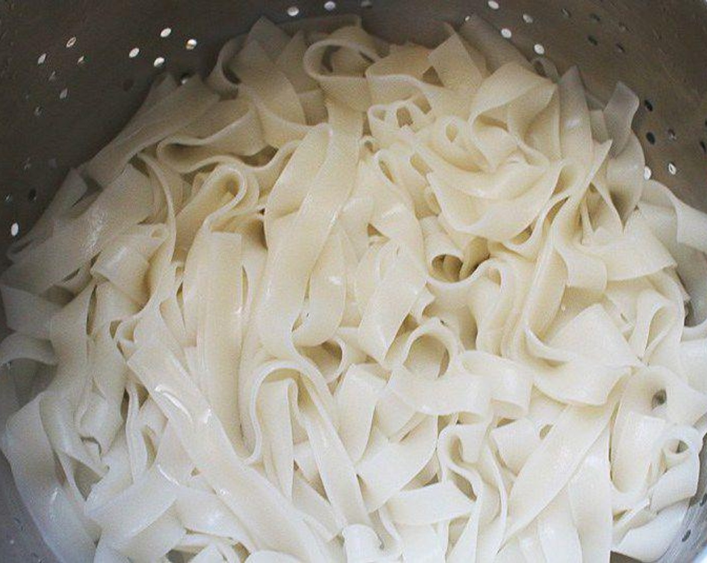 step 2 Rinse the noodles with ice-cold water, shake in a sieve to remove excess water then set aside.