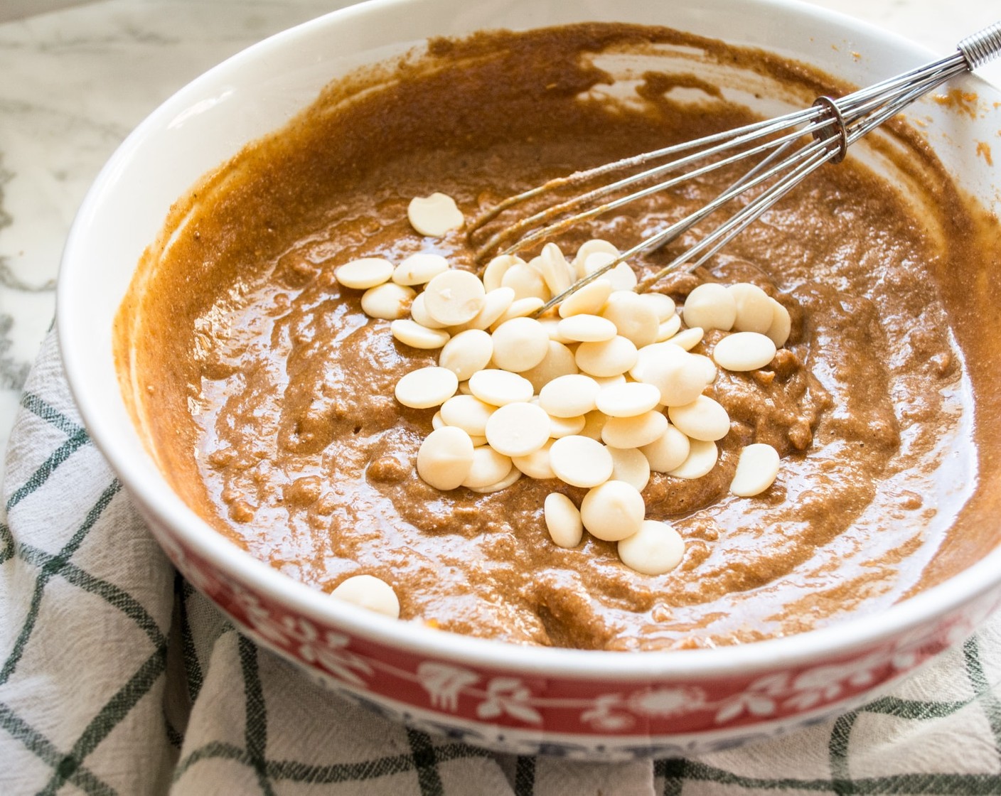 step 5 Slowly add dry ingredients to wet, stir just until combined. Fold in Yogurt Baking Chips (1/3 cup).