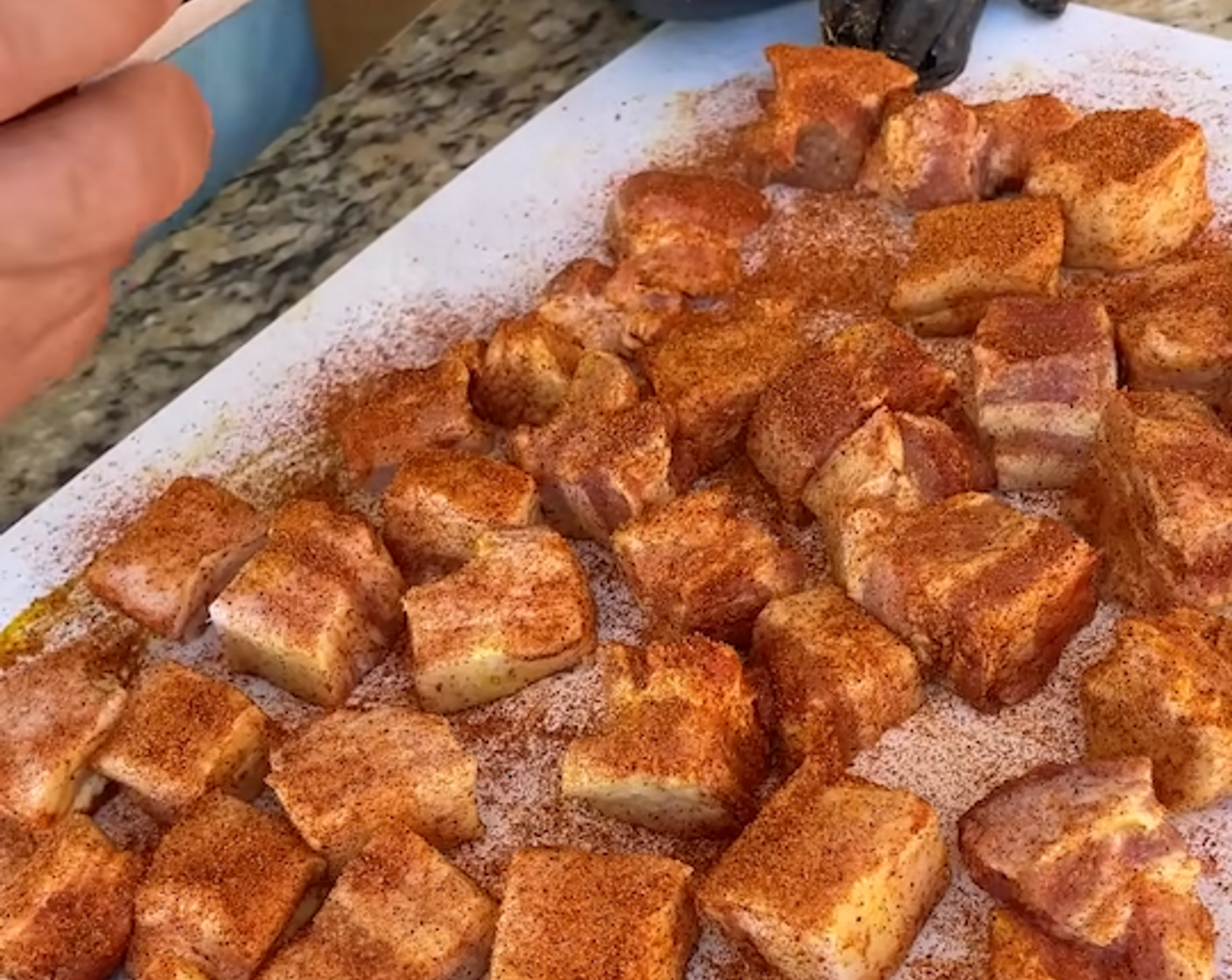 step 2 Cut Pork Belly (1) into cube-size portions, coat with Yellow Mustard (1/4 cup), and season on all sides with Barbecue Rub (1/4 cup).