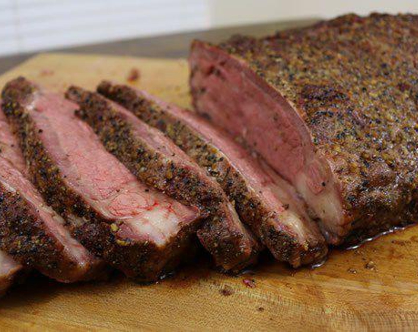 step 5 Serve the Smoked New York Strip Loin in ½” slices (about 12oz of meat) for dinner size servings. Be sure to collect the Jus from the platter to drizzle over it.