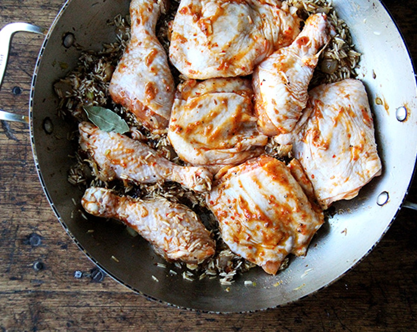 step 8 Nestle the chicken over the top of the rice. Pour Water (1 1/3 cups) all around. Nestle in the Bay Leaf (1).