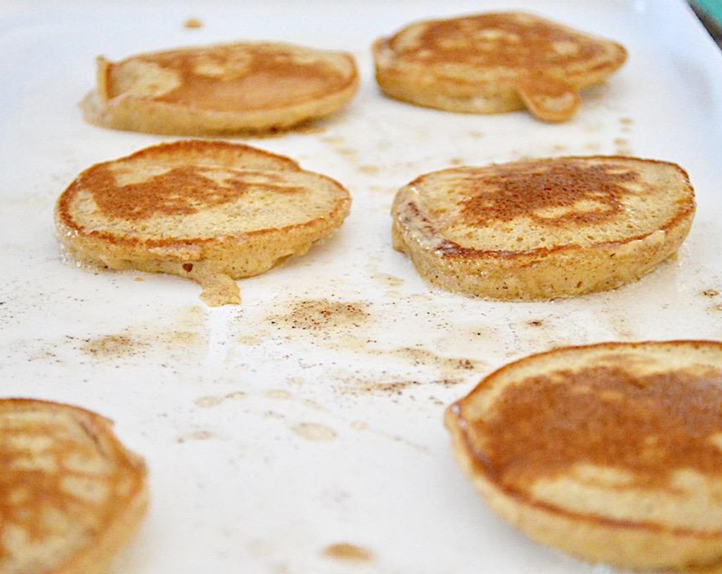 step 5 Preheat an electric griddle to 350 degrees F (180 degrees C) or a griddle pan over medium high heat. Grease it with Butter (to taste), then scoop the desired size dollops of batter on it to cook for about 3-4 minutes on each side.