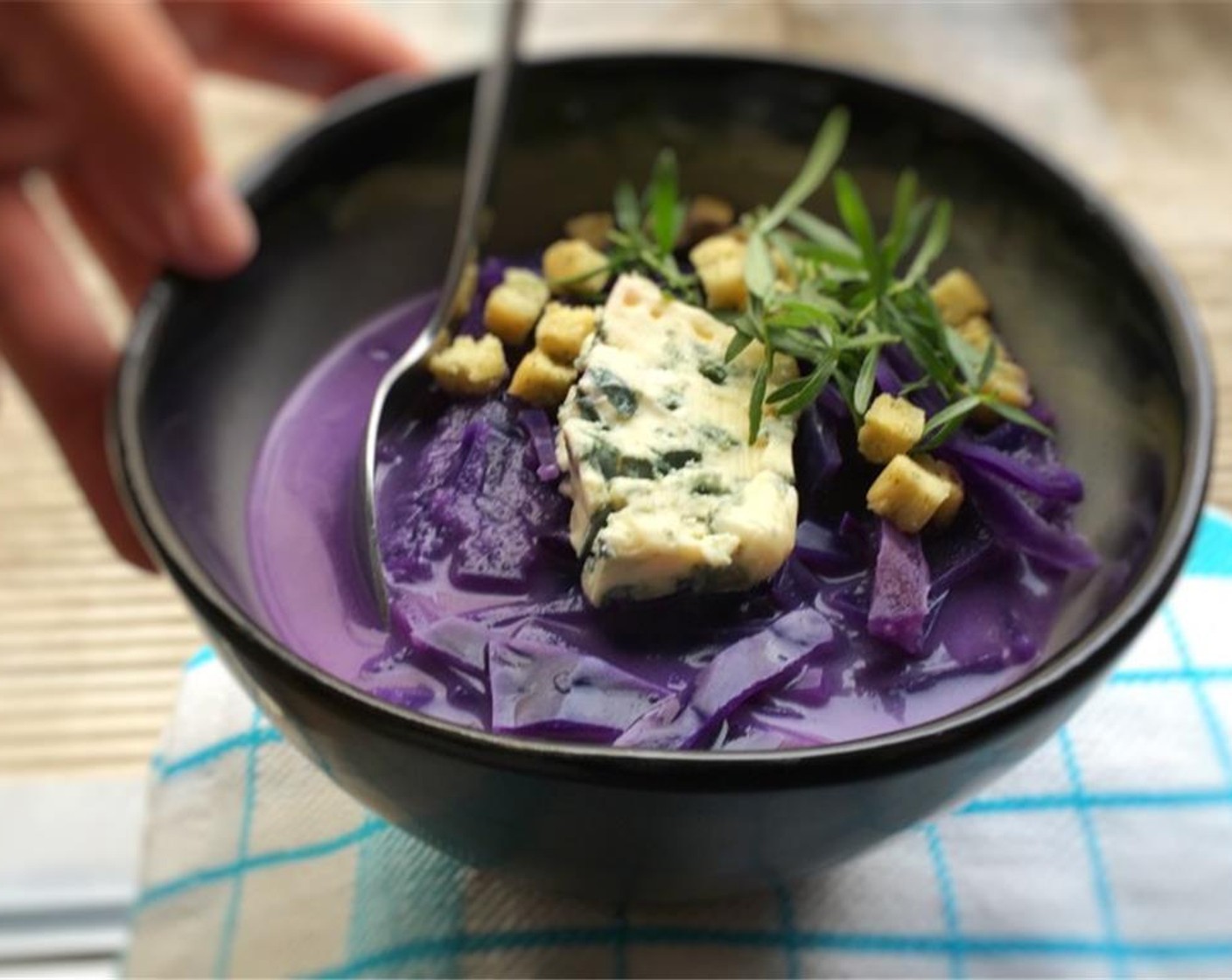 step 7 Check the seasoning and add extra Ground Black Pepper (to taste) or Salt (to taste). Scoop the cabbage soup into large bowls. Sprinkle with the Blue Cheese (2 Tbsp). Serve hot and enjoy!