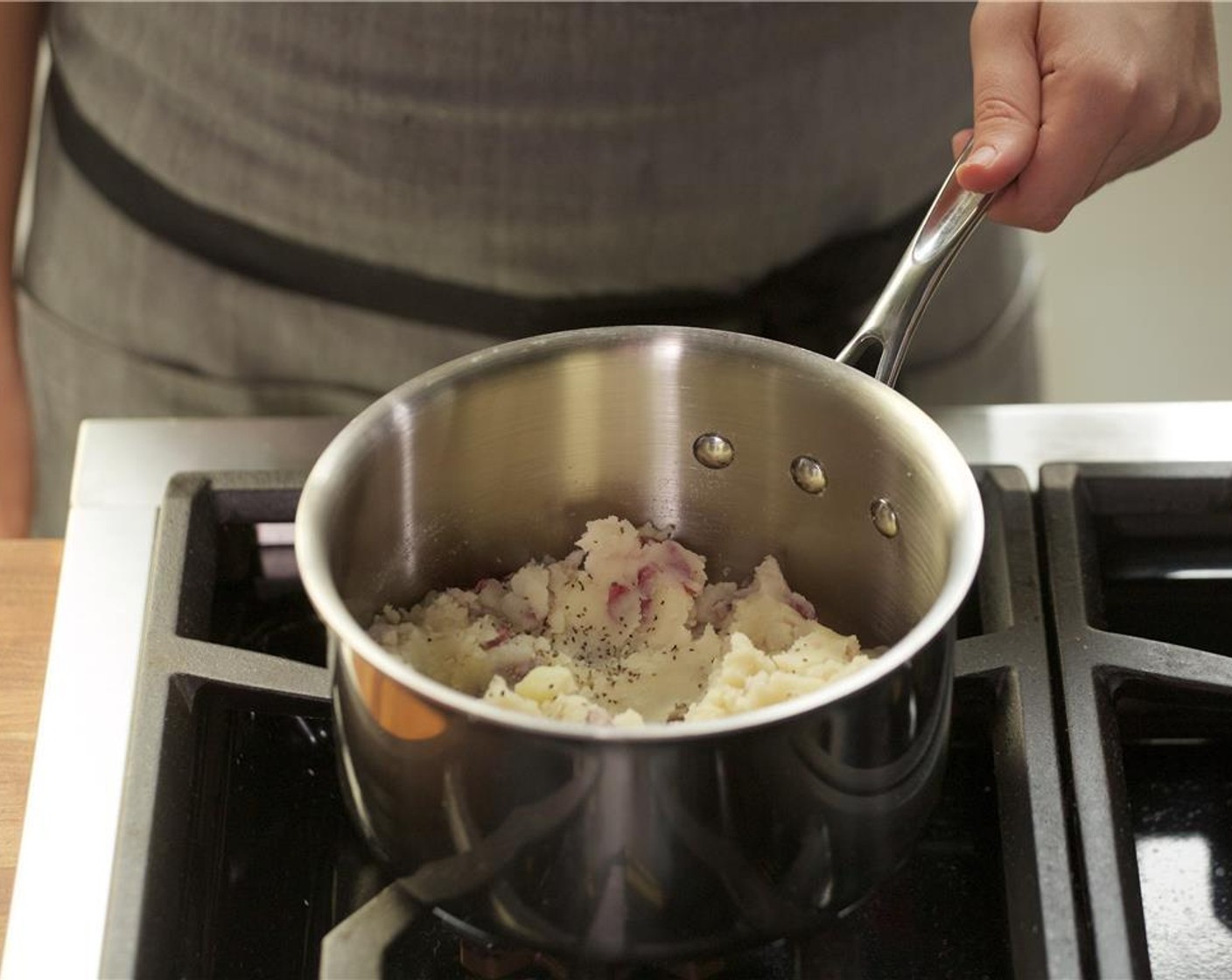 step 7 Add the garlic paste, a quarter of the Butter (1 Tbsp), Salt (1/2 tsp) and Black Pepper (1/4 teaspoon). Mash until well combined. Keep warm for plating.