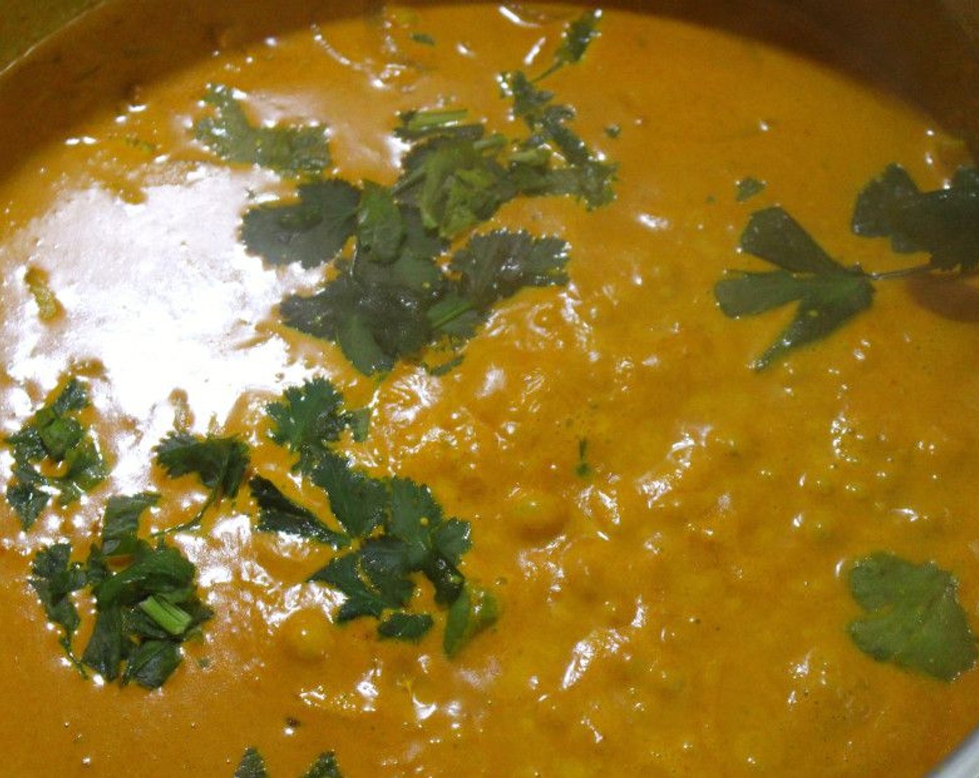 step 9 Mix in the Heavy Cream (2 cups) and then add the Fresh Cilantro (2 Tbsp). Simmer for 1 minute.