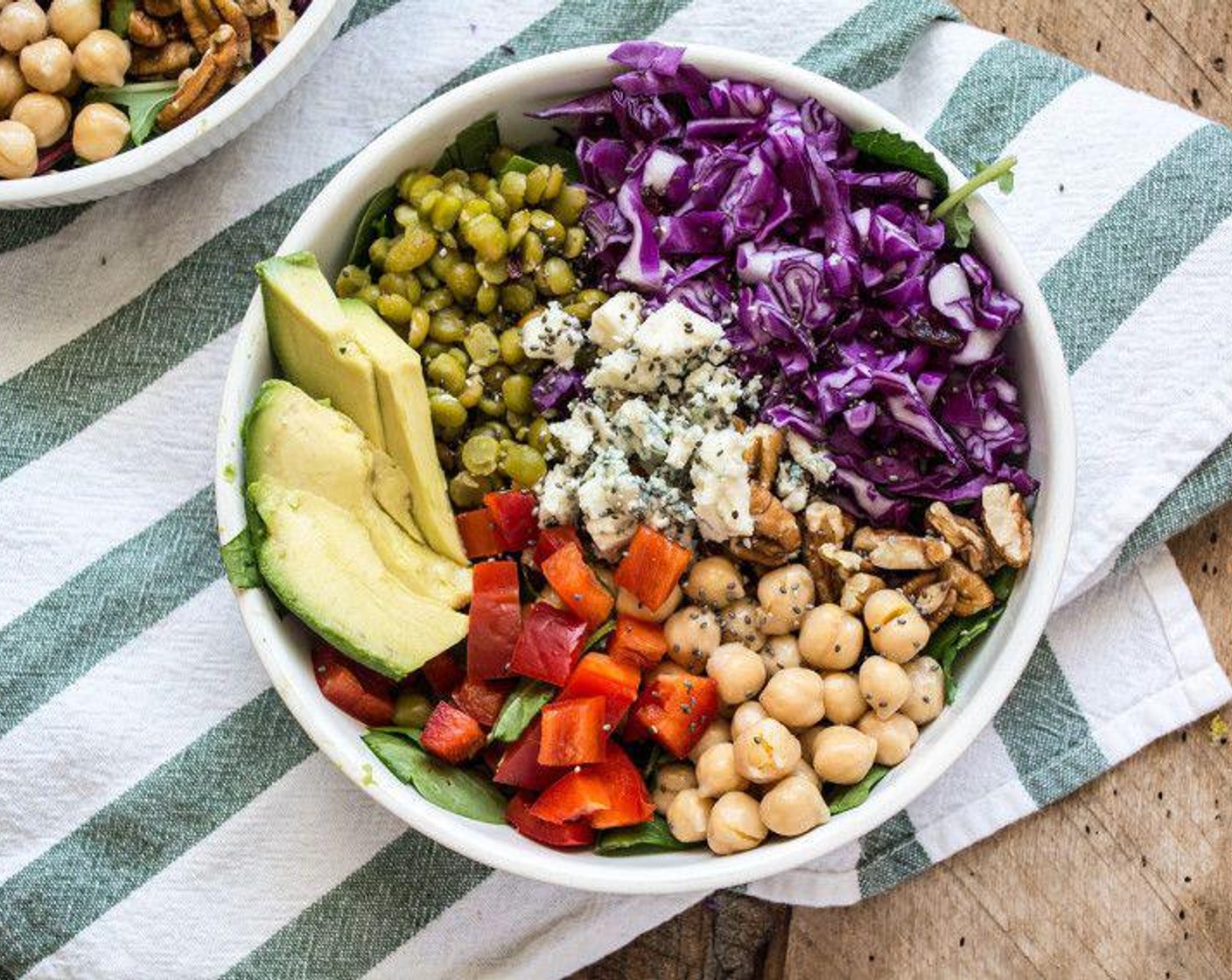 step 4 Top with Red Cabbage (1 cup), split peas, Canned Chickpeas (1/2 cup), Red Bell Pepper (1/4 cup), Pecans (1/4 cup), Avocado (1/4), Blue Cheese (3 Tbsp) and sprinkle with Chia Seeds (to taste) and your favorite salad dressing. Serve and enjoy!