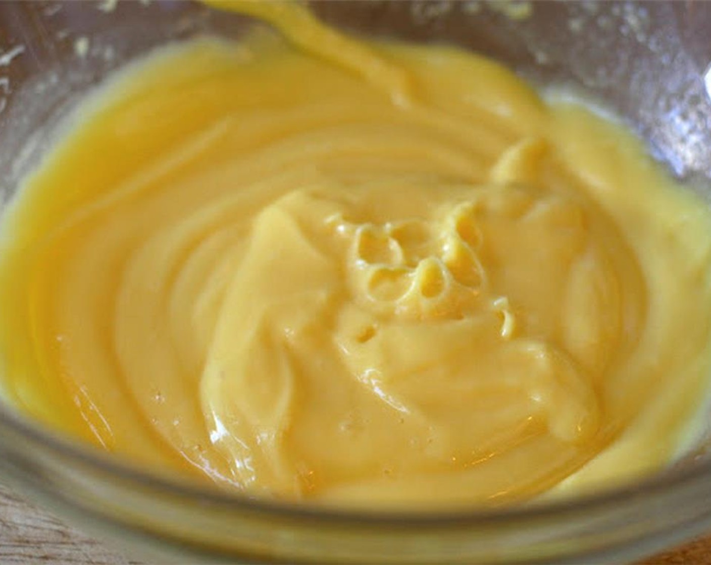 step 5 Add Vanilla Vodka (1/2 cup) and Kahlua (4 Tbsp) in a quarter cup at a time until completely incorporated.